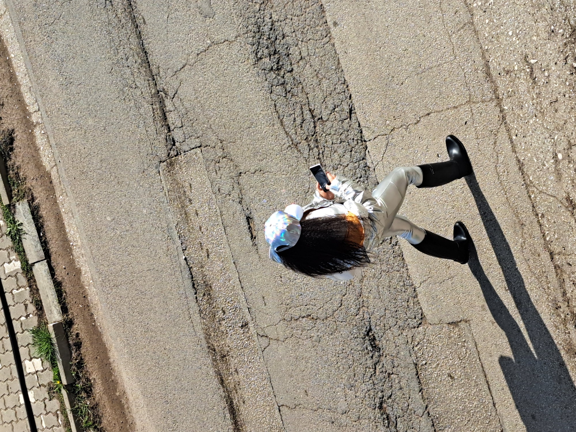 Person in silver suit spotted on cracked pavement in Bulgaria