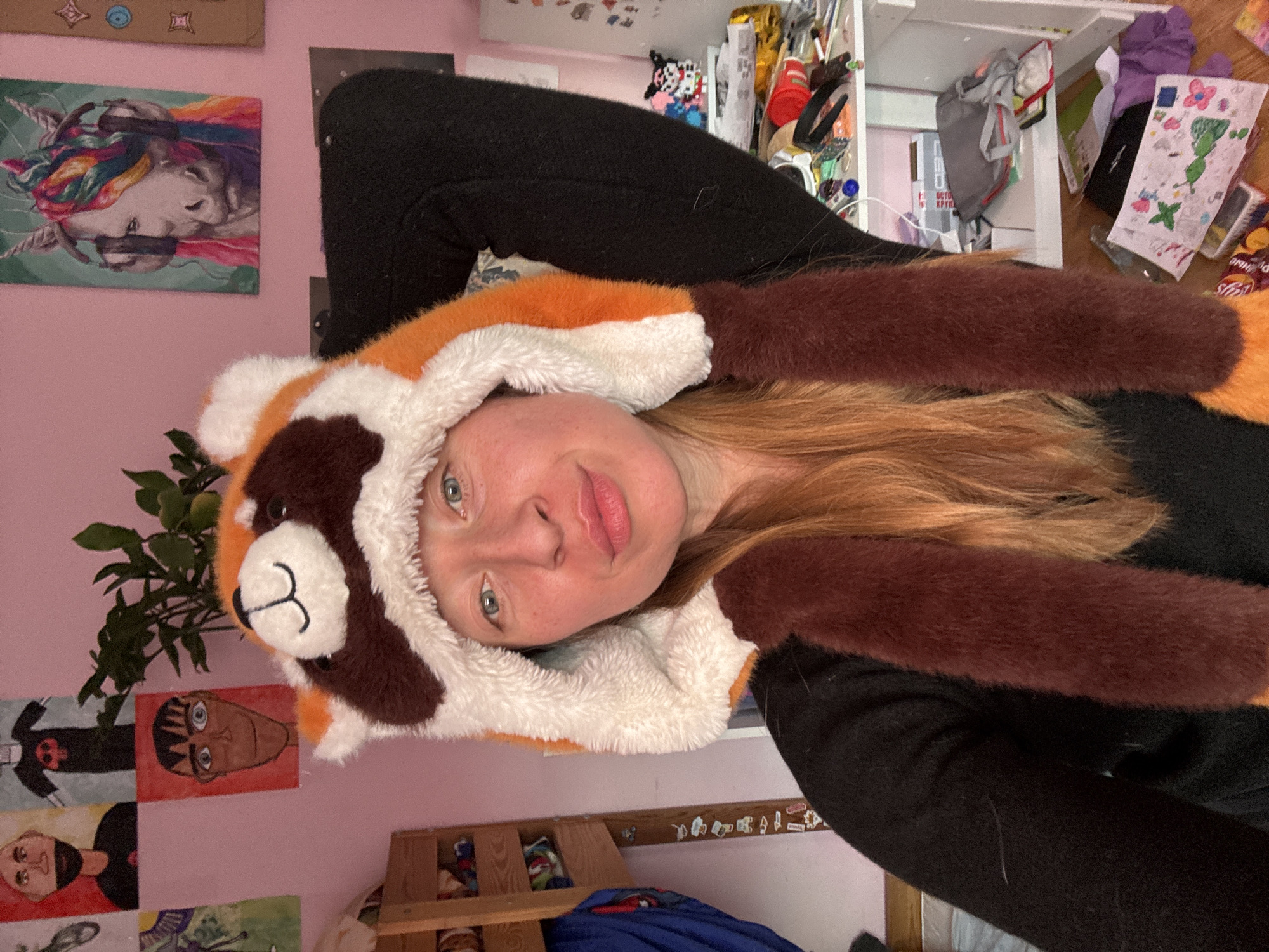 Woman in red panda hat photographed with tulips, Noviy