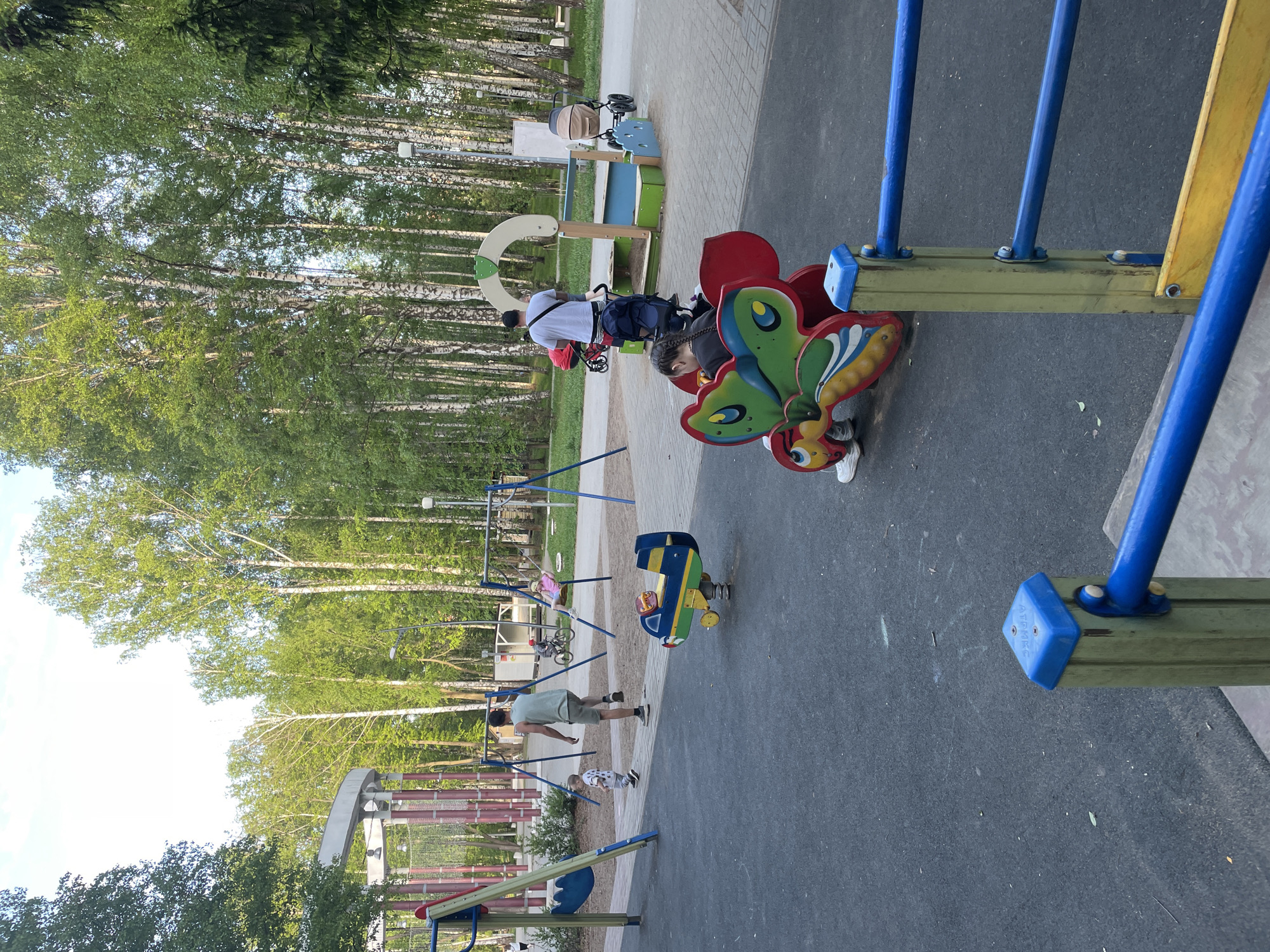 Family playground visit documented in Perm, Russia park