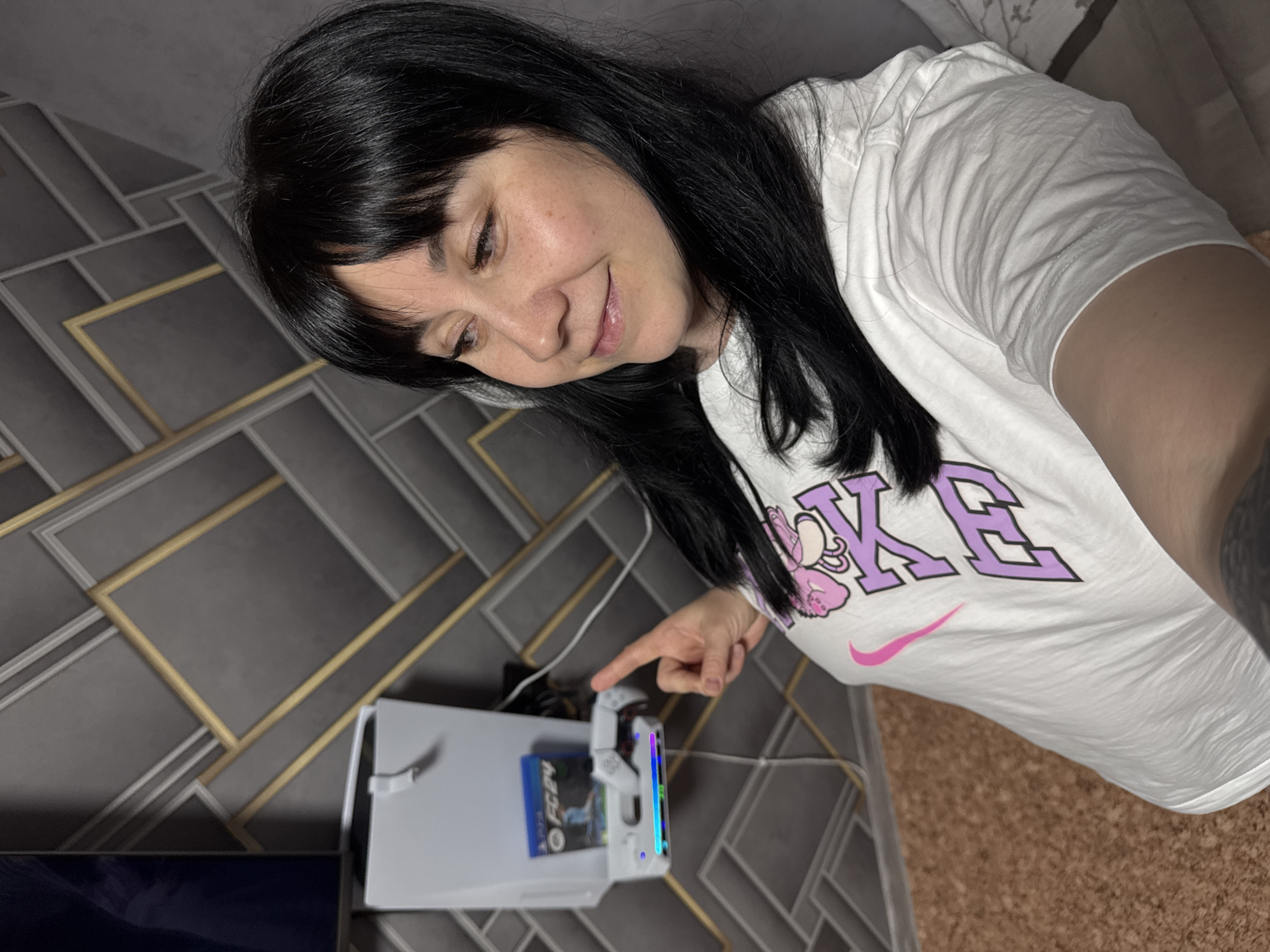 Woman in Nike shirt photographed smiling in Zav'yalovo, Russia