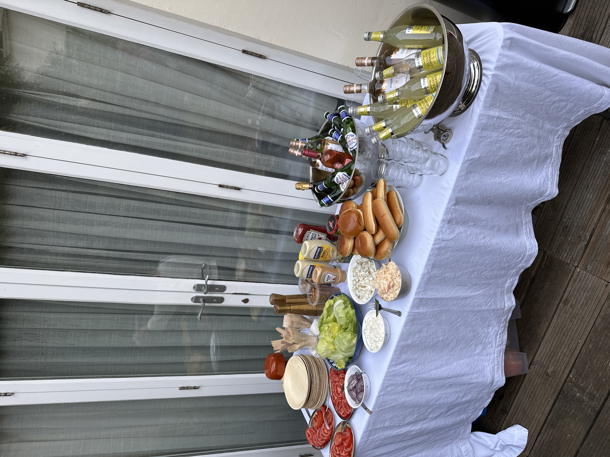 Small outdoor gathering with buffet and dog in London