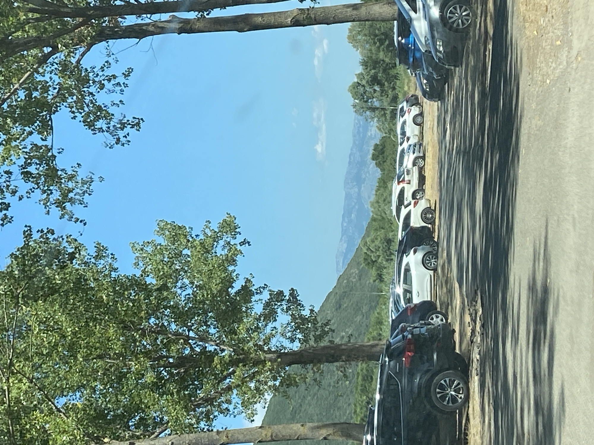 Summer gathering at a Montenegro campsite, mountains in the backdrop