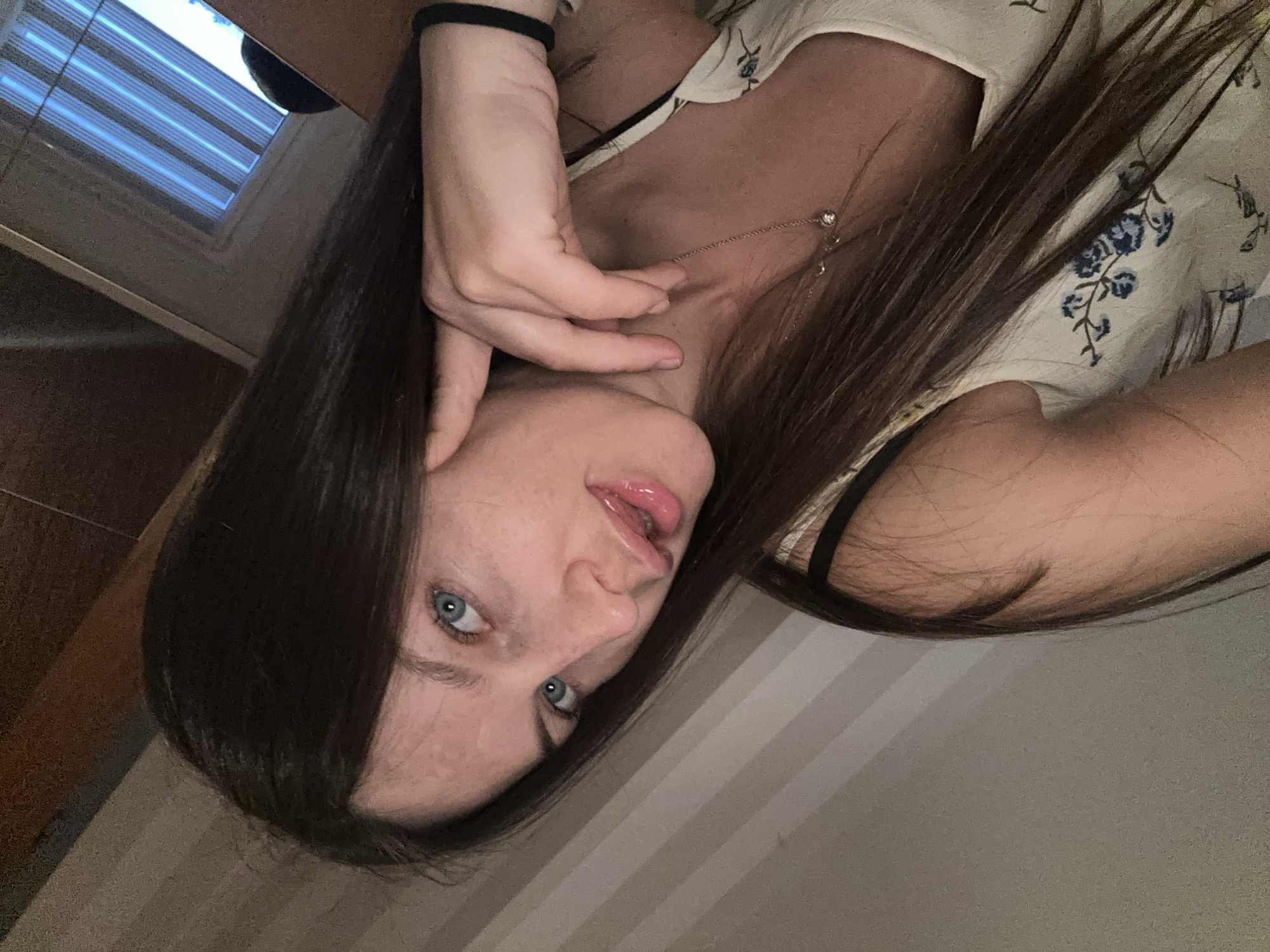 Young woman takes selfies during evening photo session in Germany