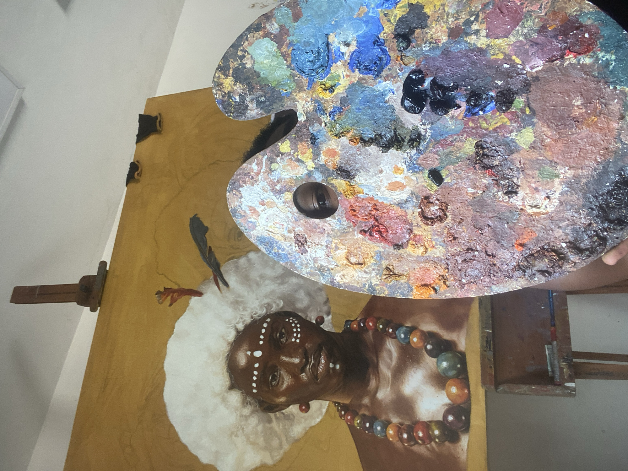 Artist documented painting portrait in Ado Nigeria studio