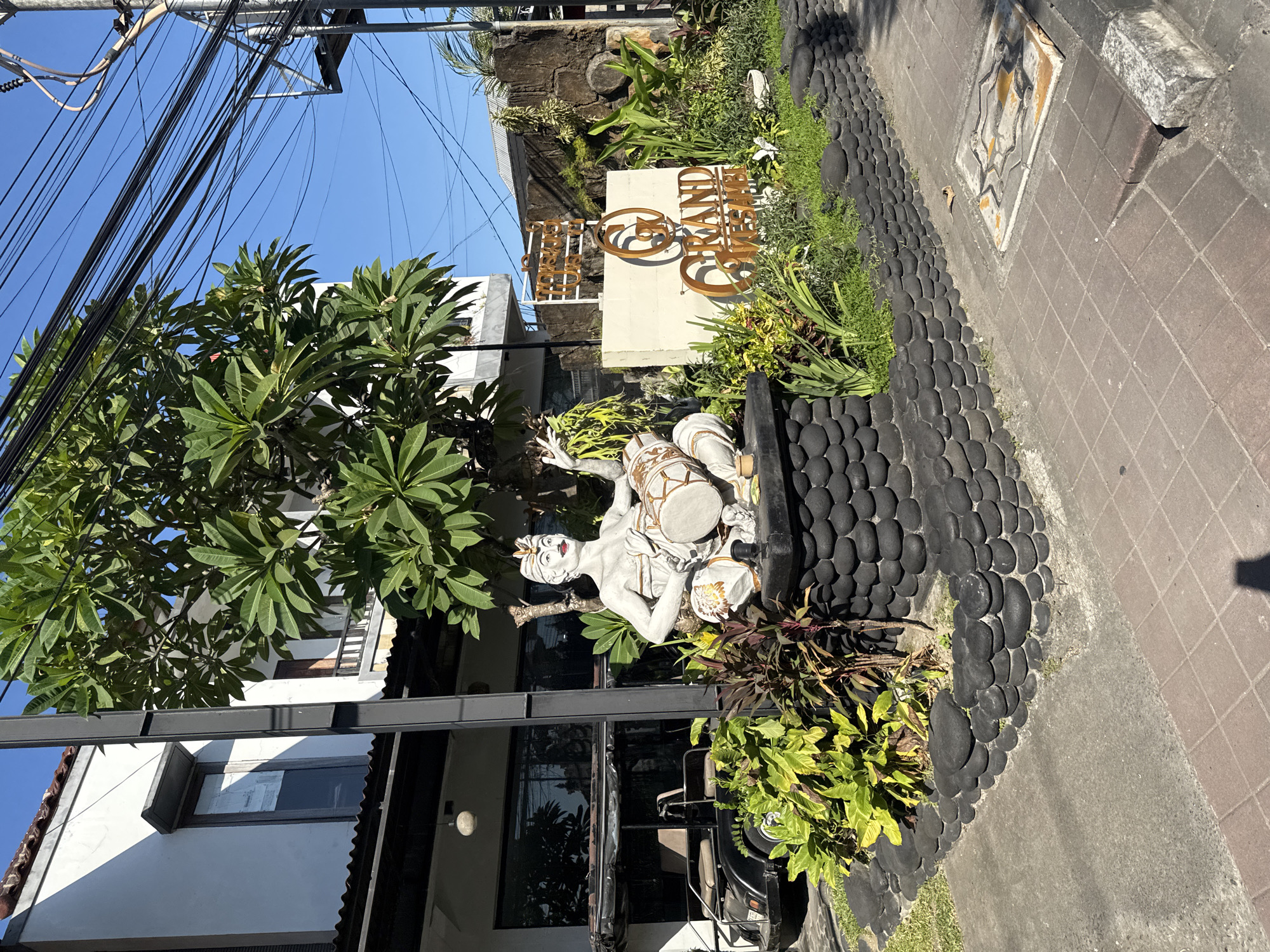 Busy North Kuta street on a sunny Bali morning