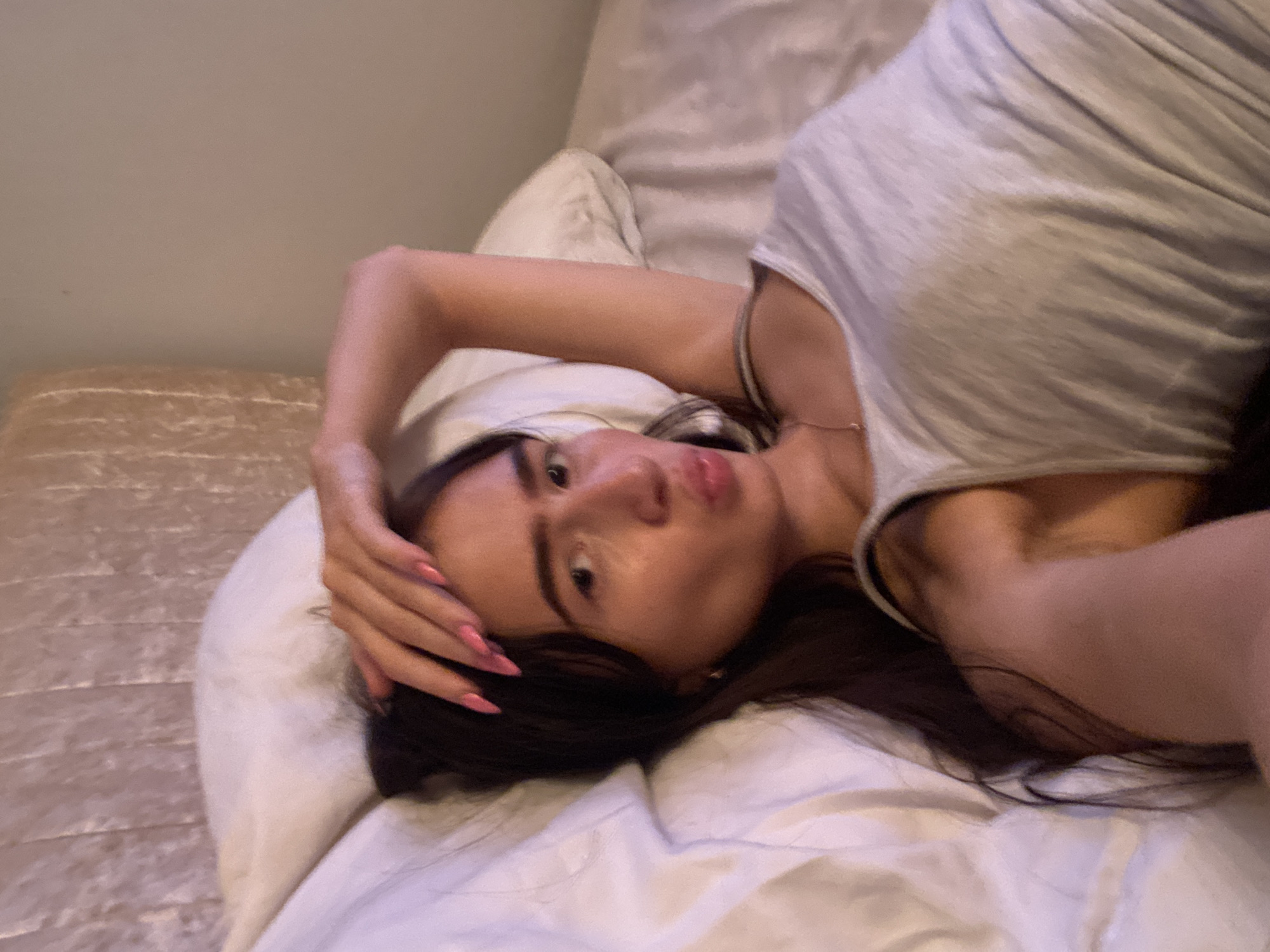 Woman photographed resting on bed in Welwyn Hatfield