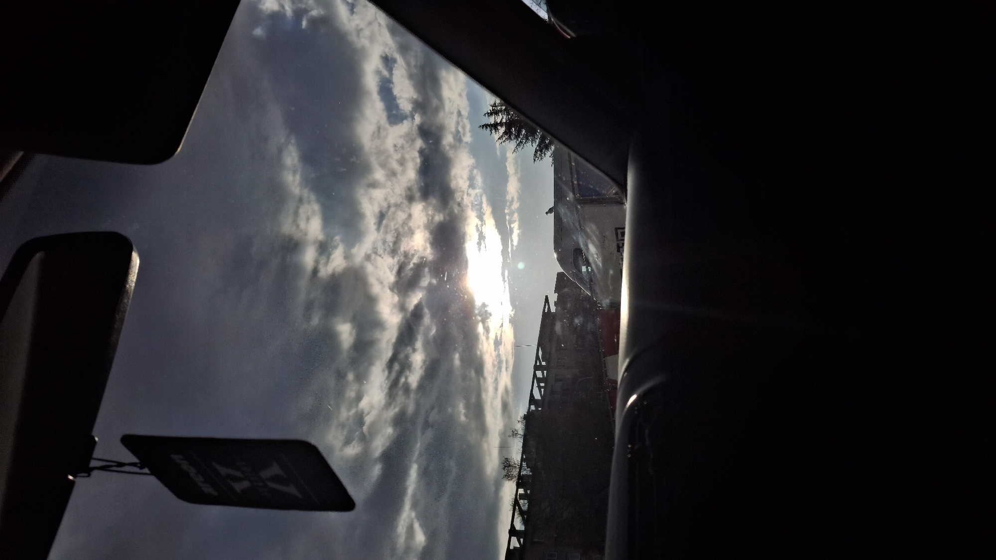 Vehicle occupant observes sky through windshield on April 12