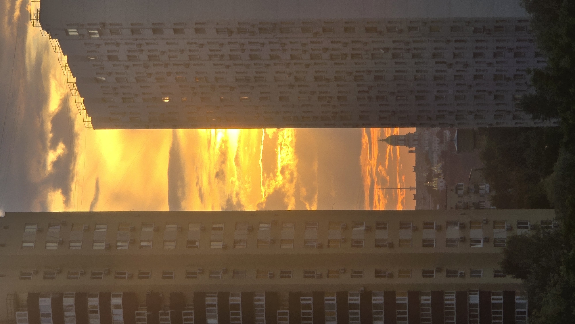 Kyiv residential skyline glows at sunset