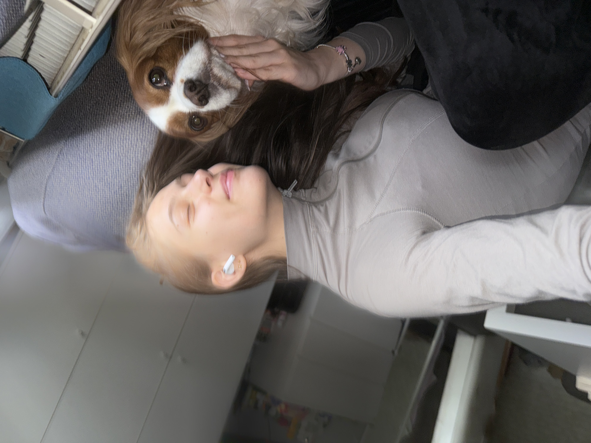 Woman enjoys quiet morning with dog in Sofia home