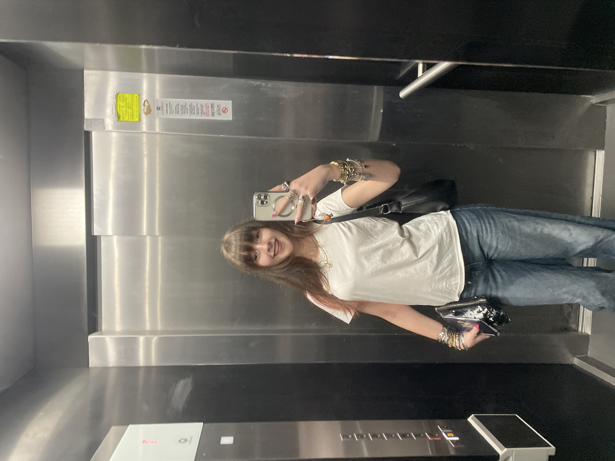Woman takes selfie in Raanana elevator Tuesday morning