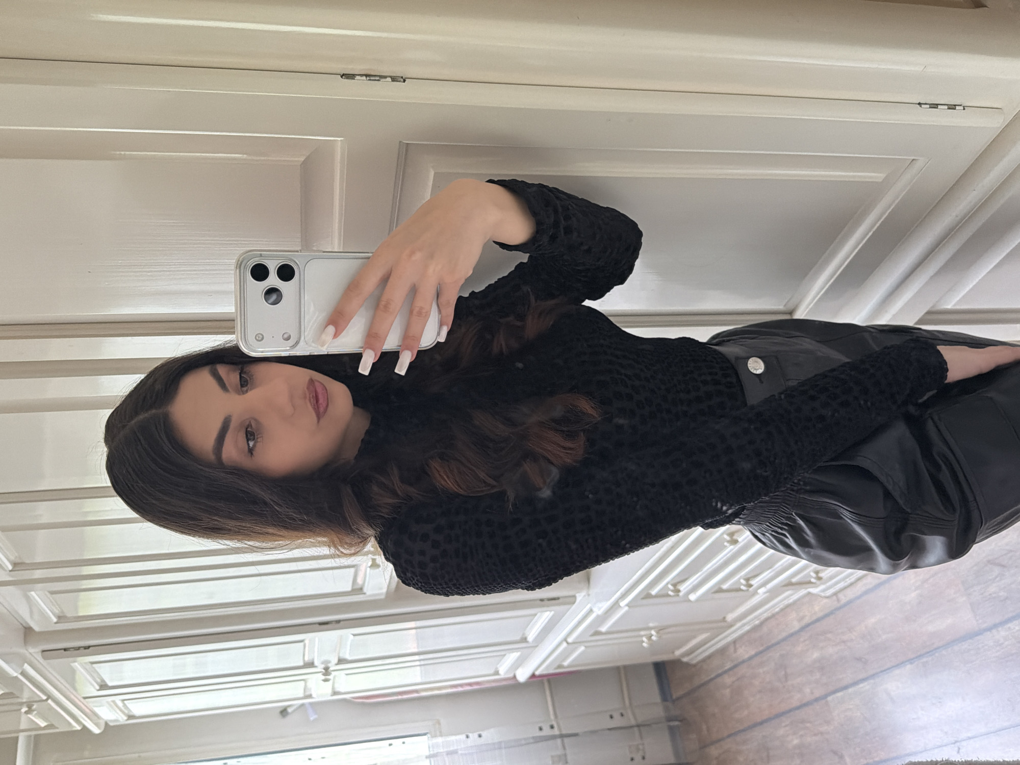 Woman takes selfies indoors in Gabrovo, Bulgaria