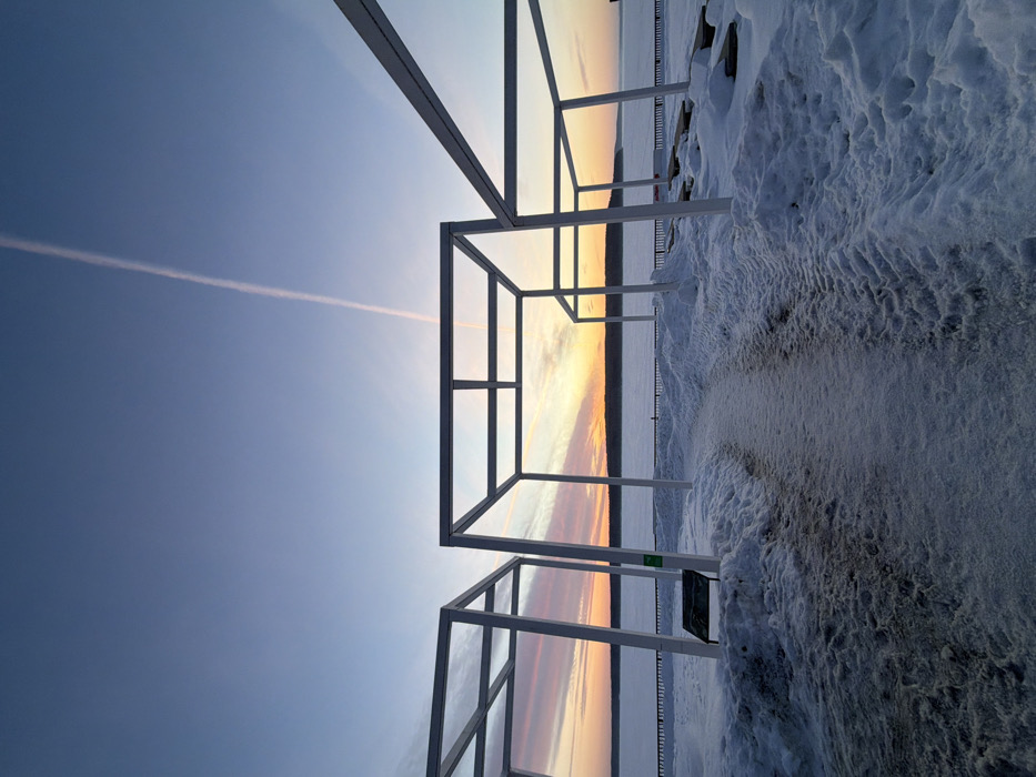 Winter sunset walk documented along Chaikovsky reservoir embankment
