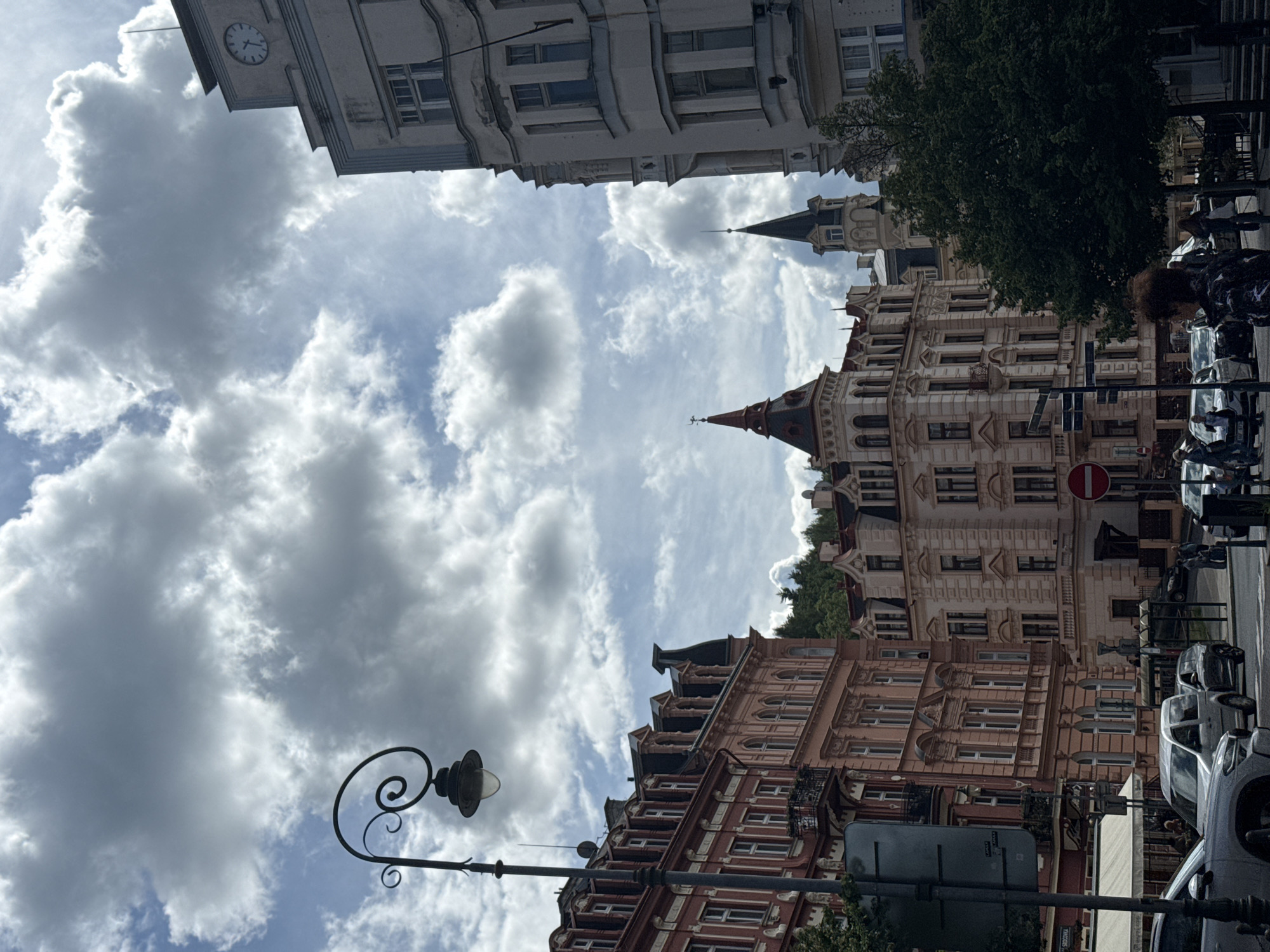 Tourist captures historic architecture during afternoon walk in Karlovy Vary