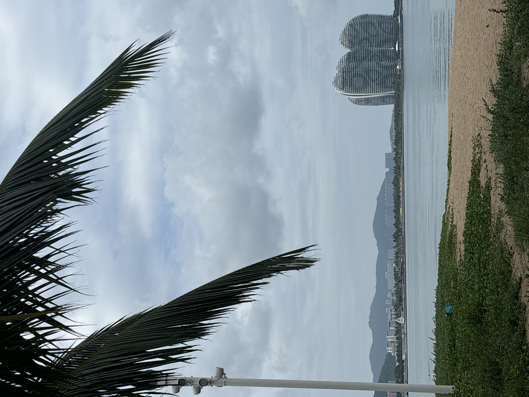 Overcast beach day in Tianya District with coastal architecture
