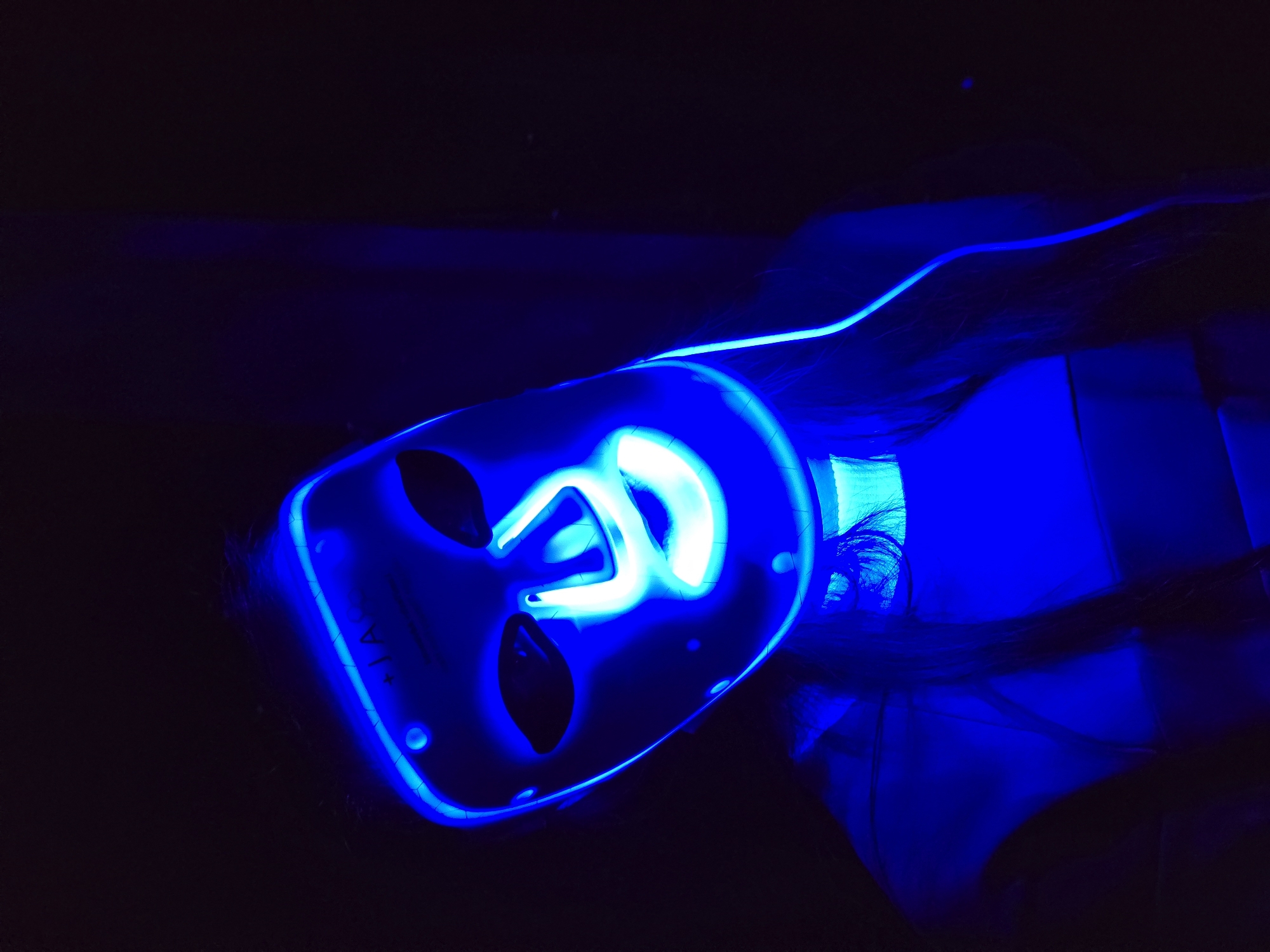 Person uses LED light therapy masks in evening session