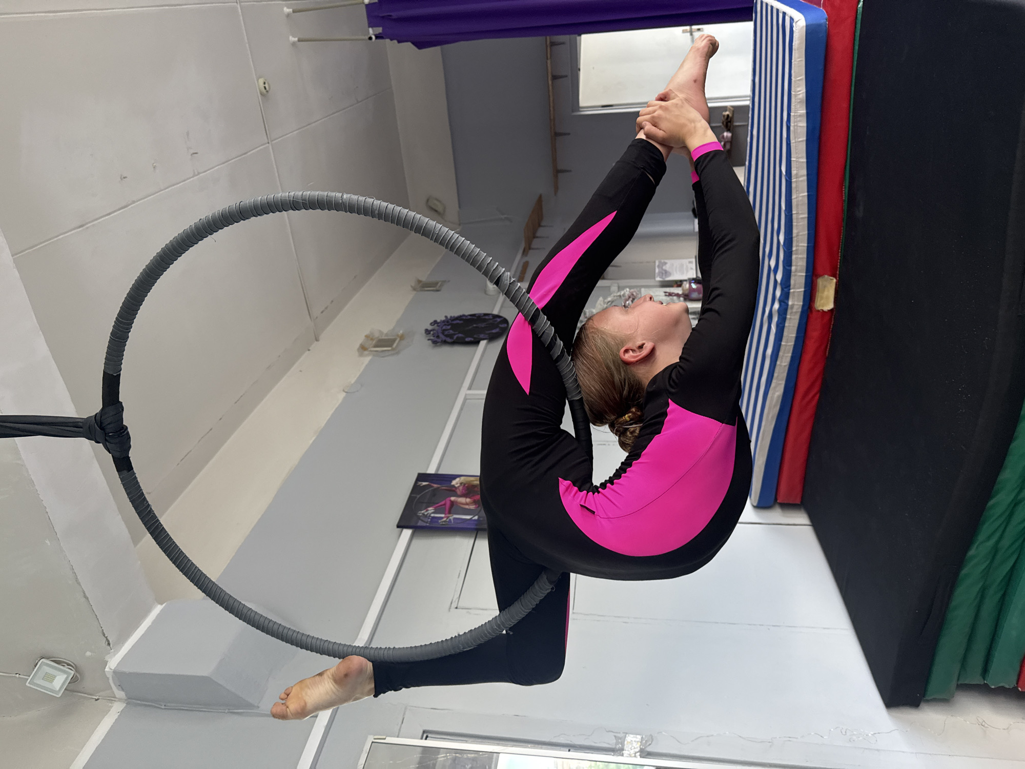 Young gymnast trains on aerial hoop in Dnipro studio