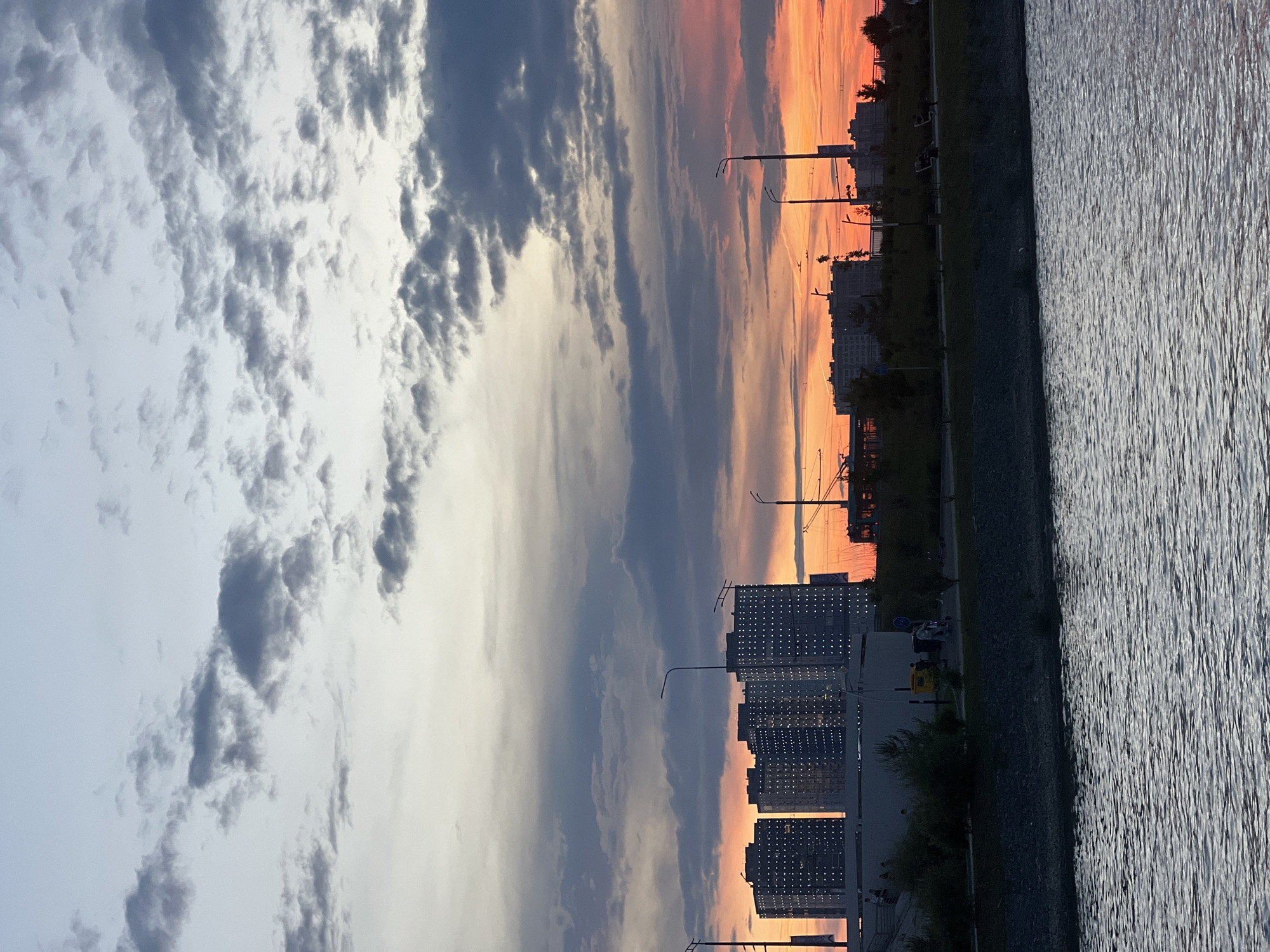 Sunset observed over Kazan waterfront with city skyline visible