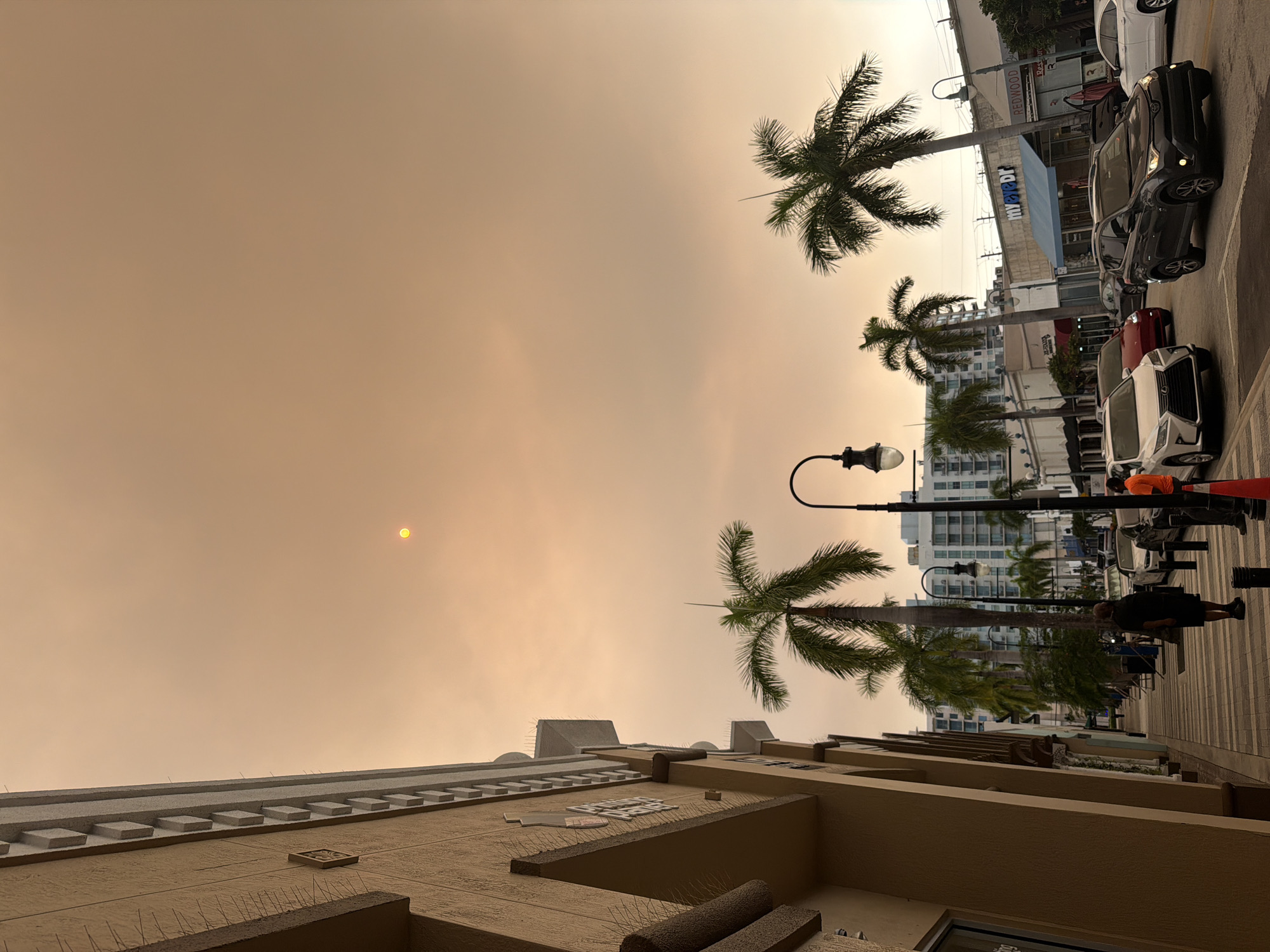 Heavy haze turns Hollywood skies orange at dusk