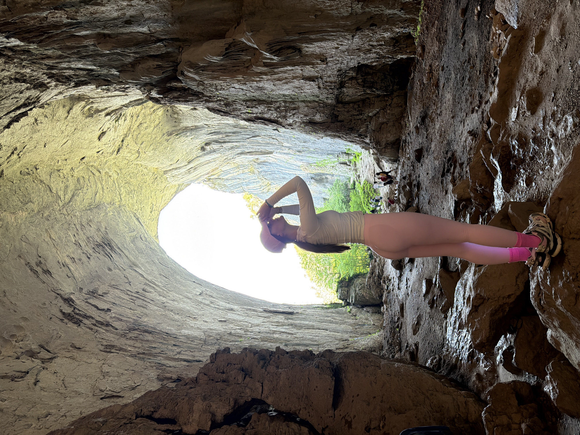 Tourists explore and photograph Bulgaria's Devetashka Cave