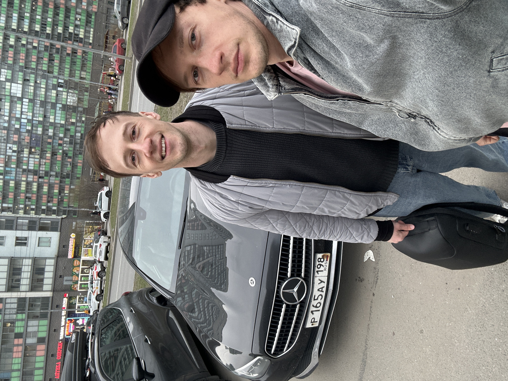 Two men photographed with Mercedes-Benz in Murino, Russia