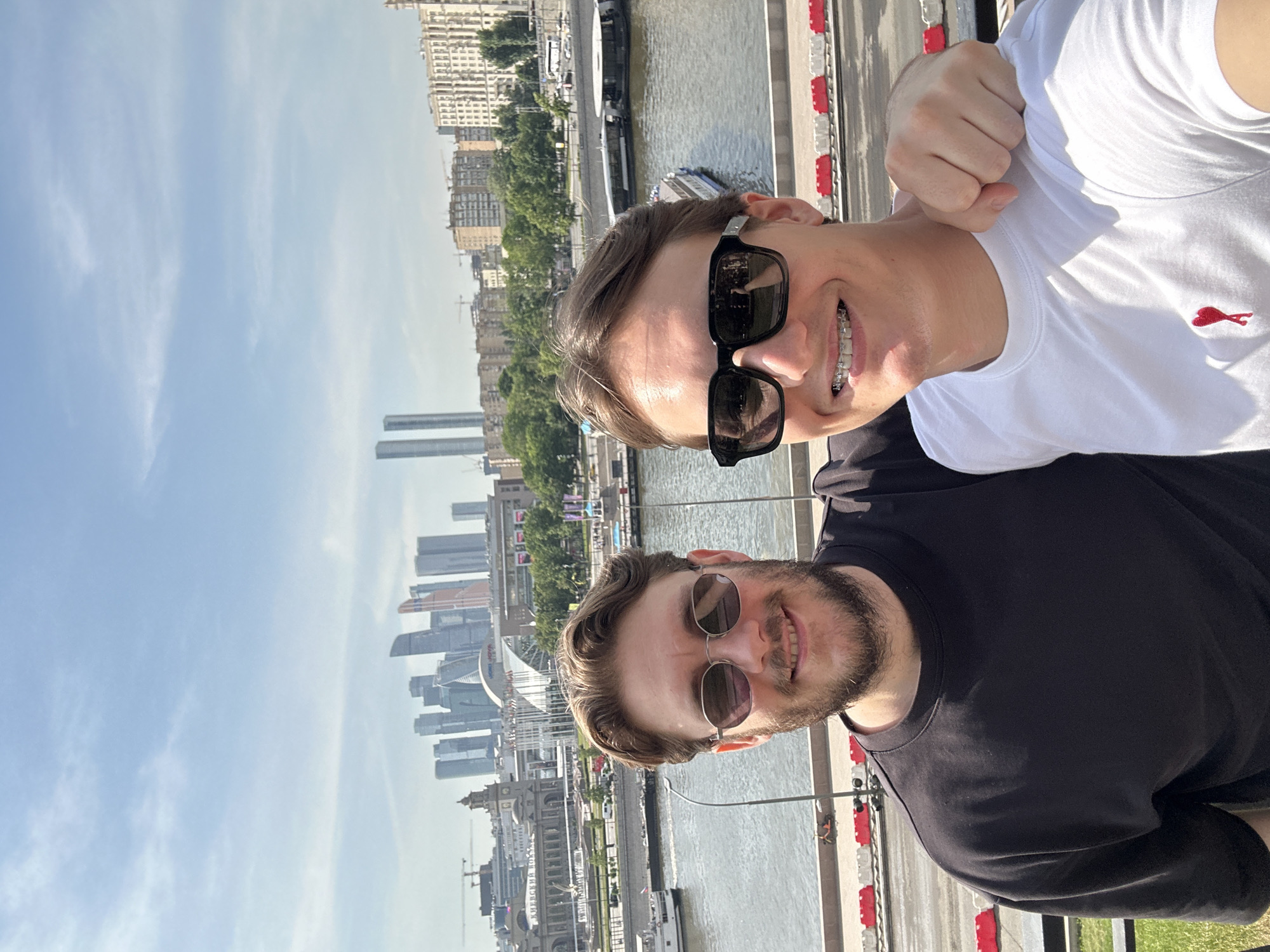 Two men photograph selfie at Moscow River embankment