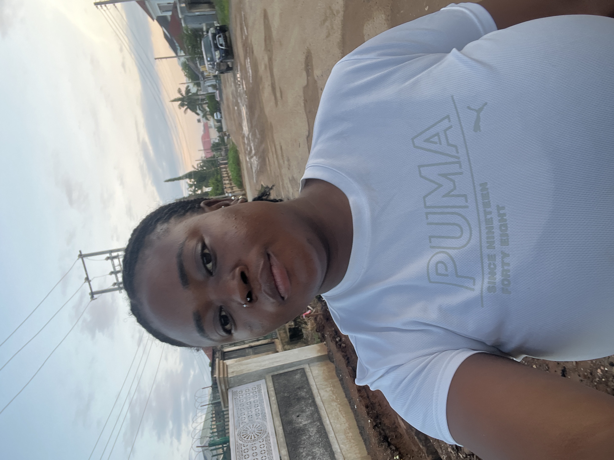 Morning street life across a residential Abuja neighborhood