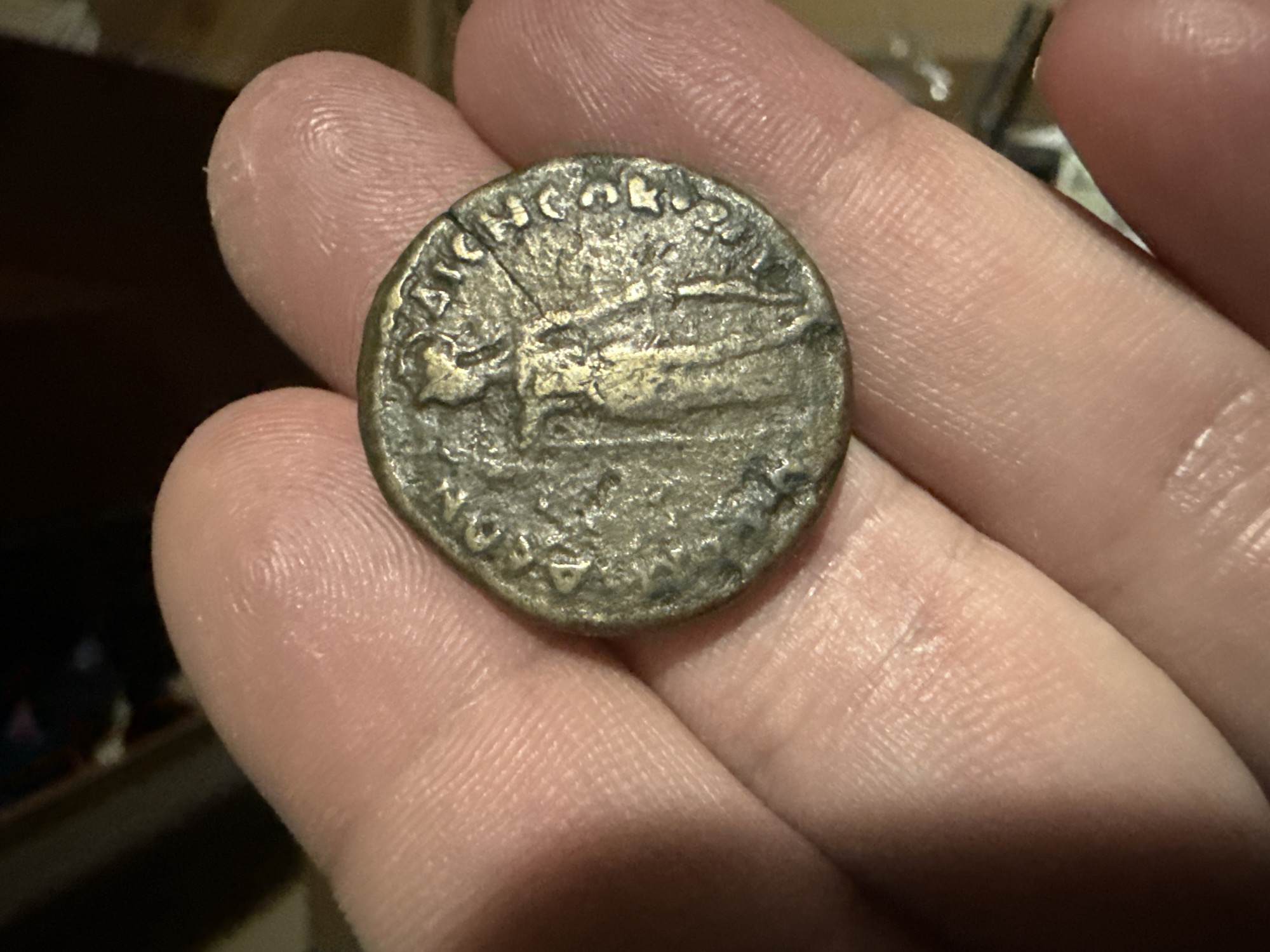 Person examines coin and decorative Nokia phone in Bulgaria