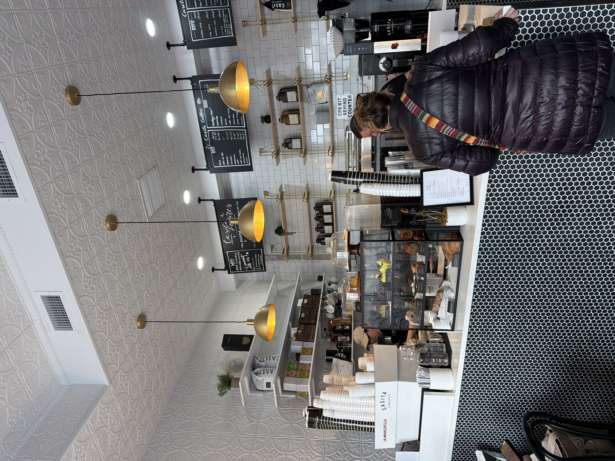 Brooklyn coffee shop interior documented, featuring decorative ceiling patterns