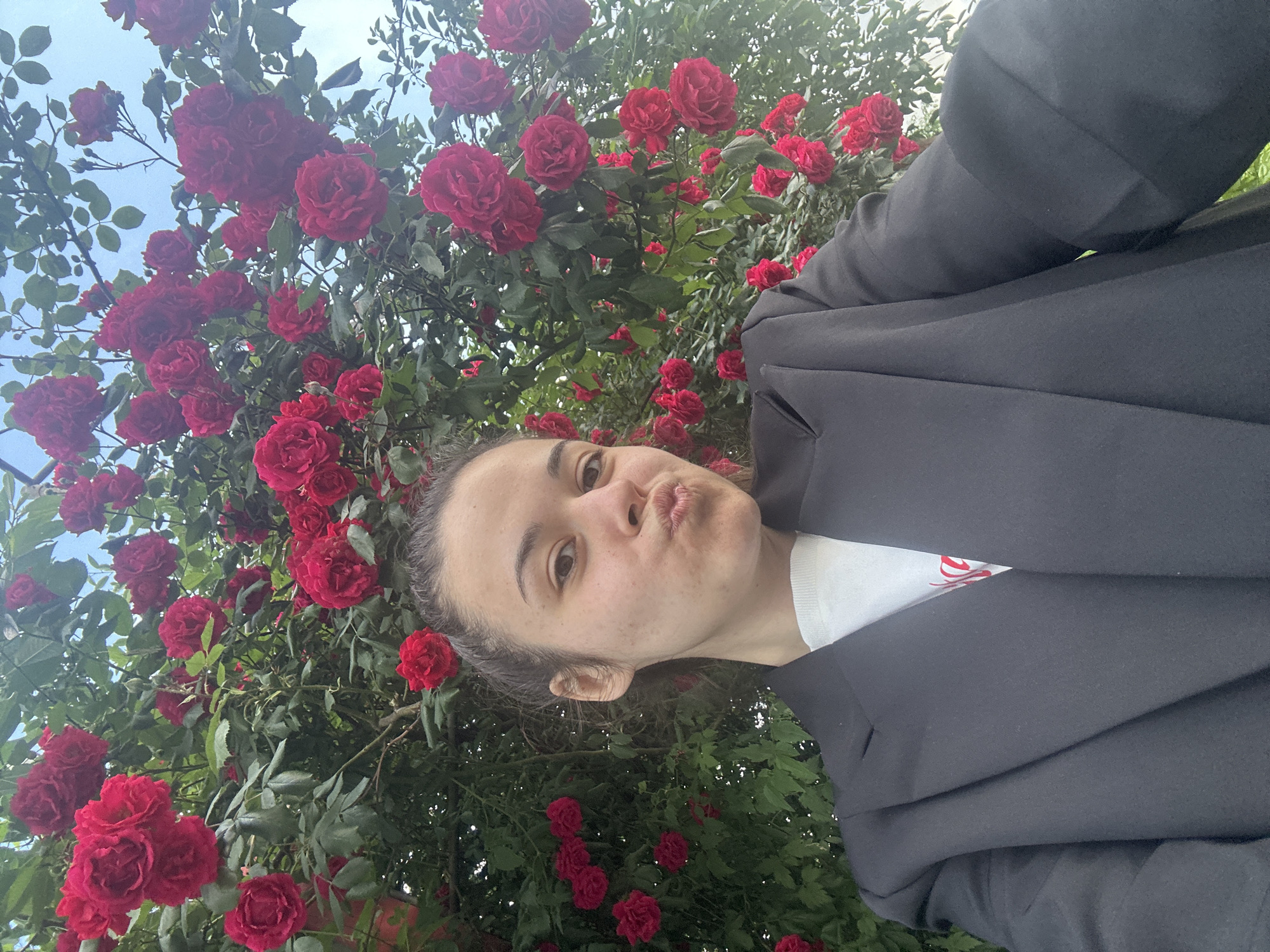Couple photographs themselves among blooming roses in Sofia