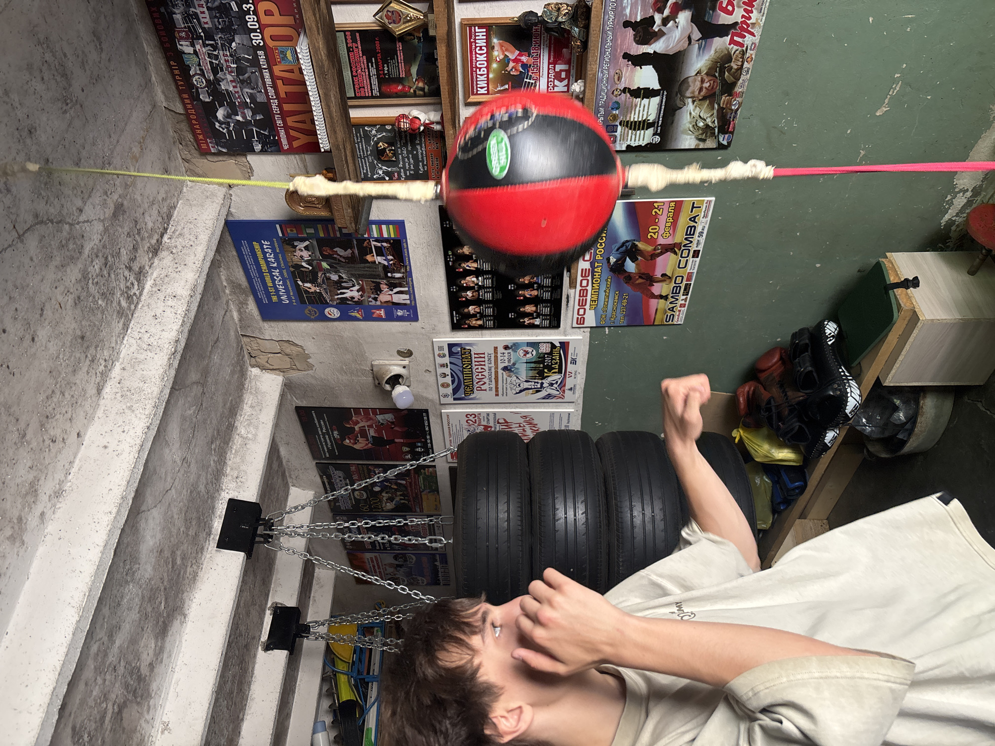 Boxing training session observed in basement gym in Chaikovsky
