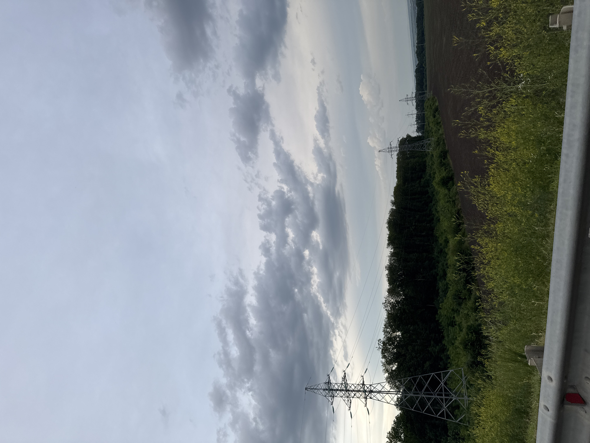 Driving through Stavropol under a stormy golden-hour sky