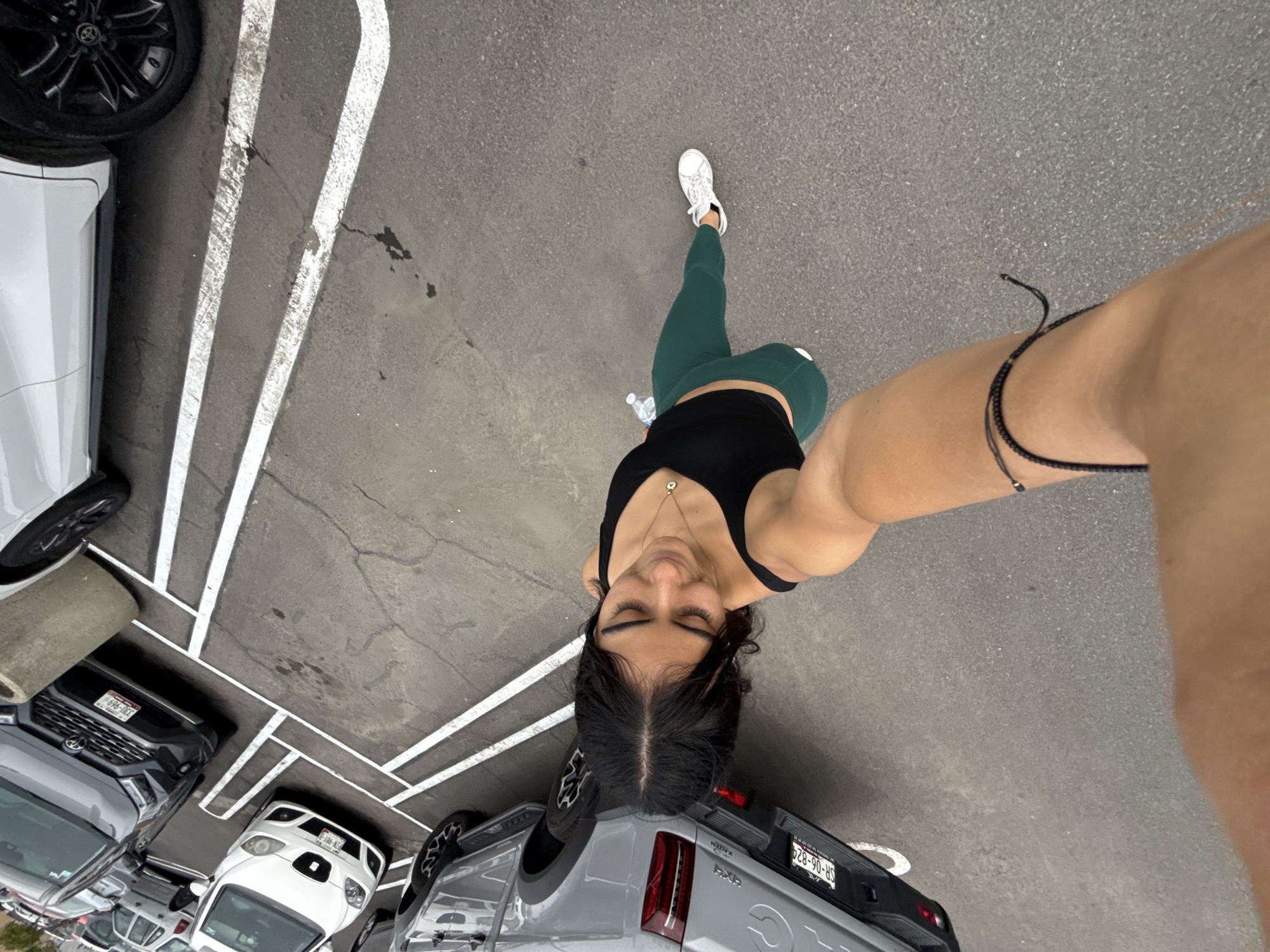 Woman captures casual selfie moments in Puebla parking lot