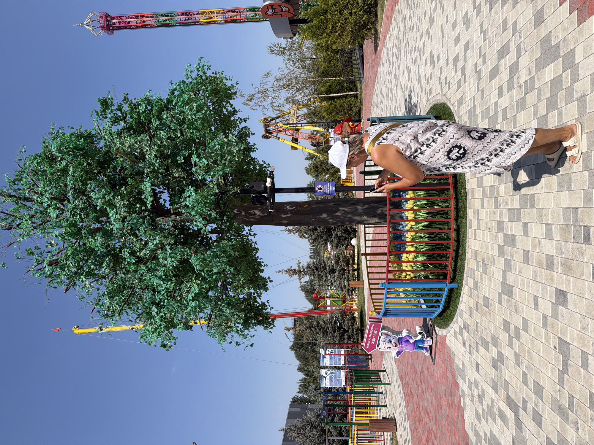 Exploring rides, statues, and walkways at a cartoon-themed amusement park