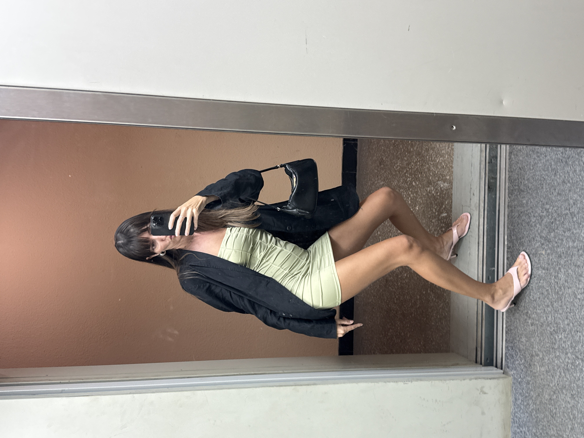 Elevator mirror selfie in Moscow, green dress and black blazer
