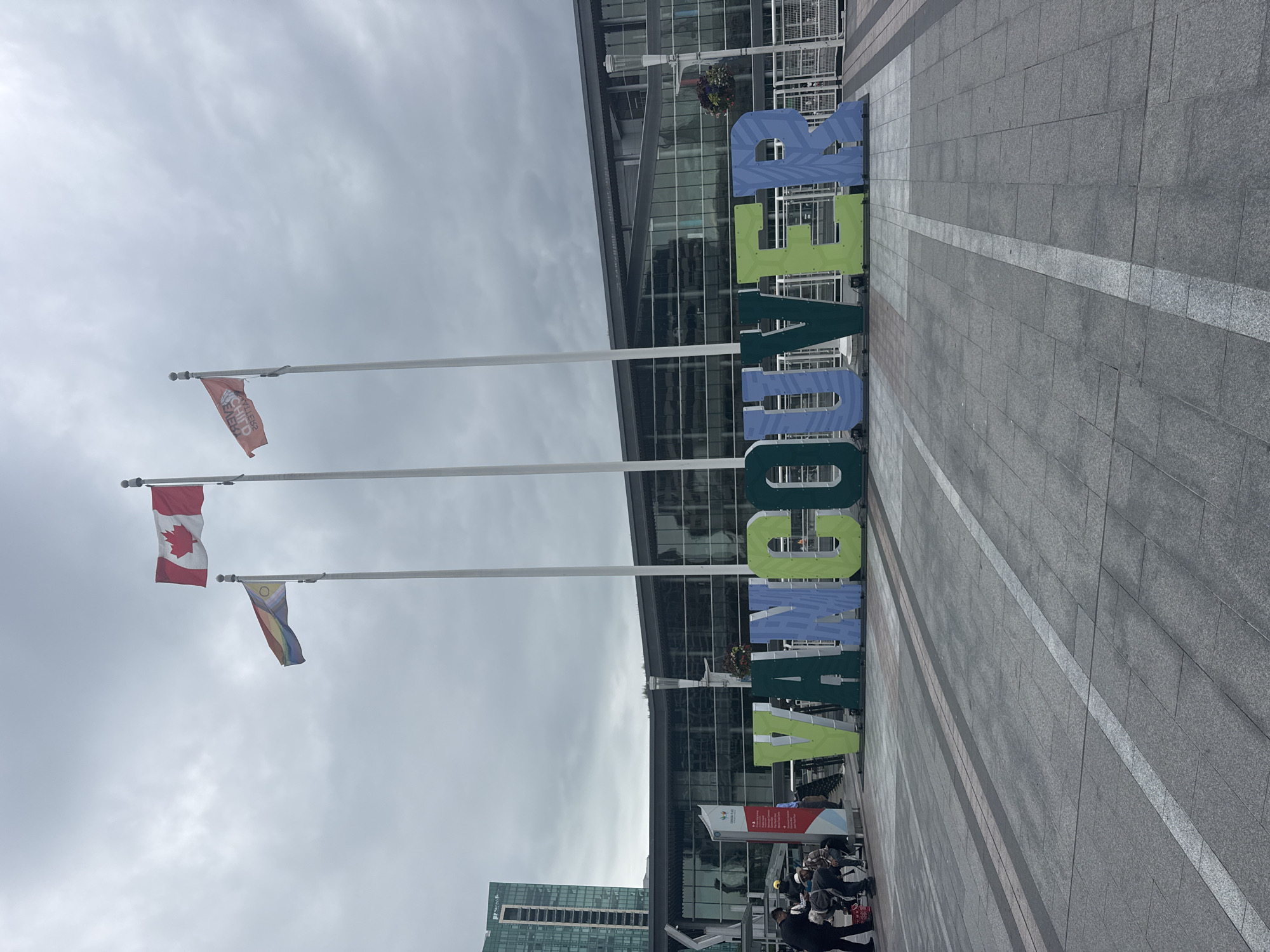 Canada Place waterfront buzzing on a cloudy Vancouver afternoon