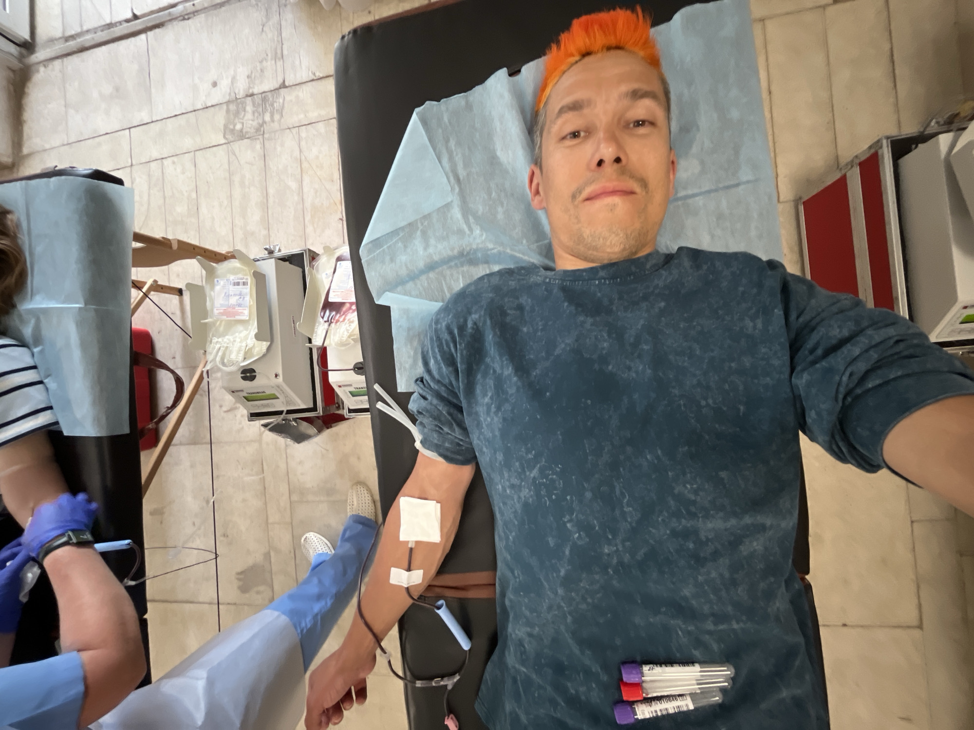 Morning scenes captured in Chaikovsky: blood donation, school gathering, spring blooms
