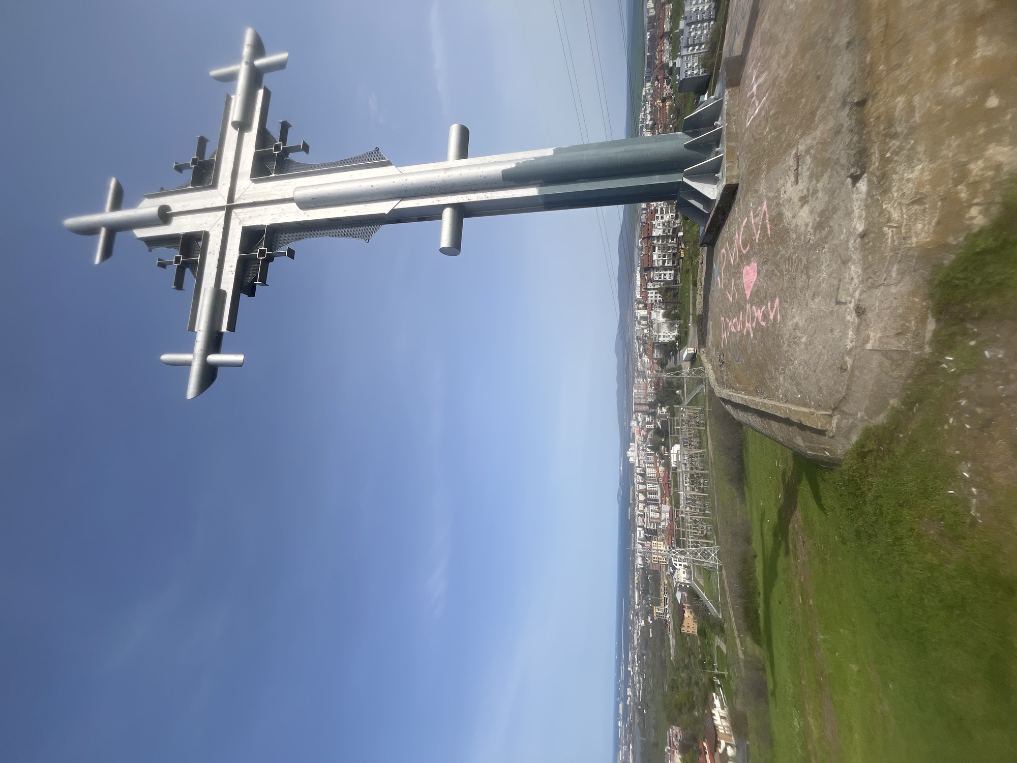 Burgas cityscape documented featuring prominent cross and hillside views