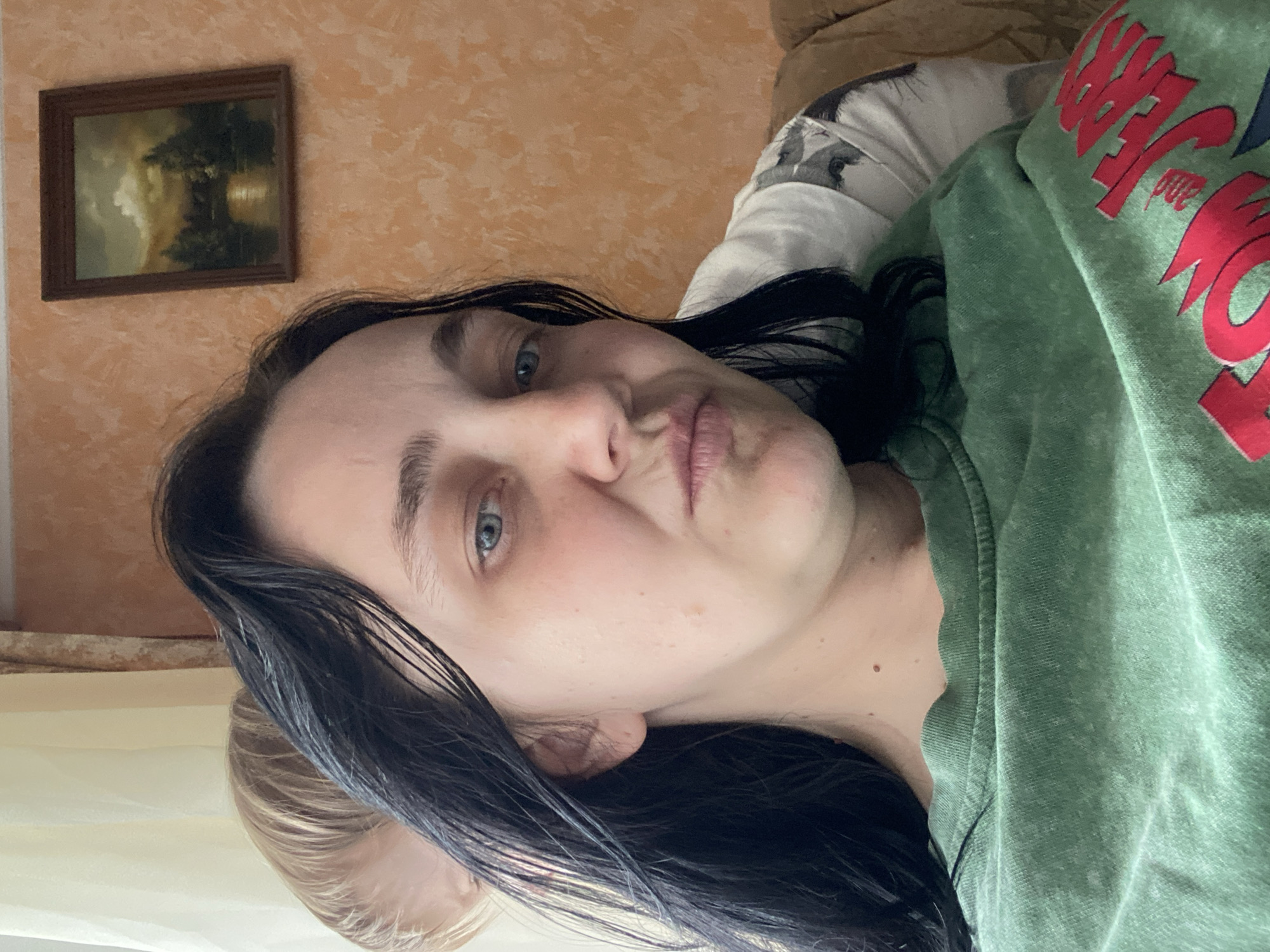 Nine selfies on a recliner, green Tom and Jerry tee throughout