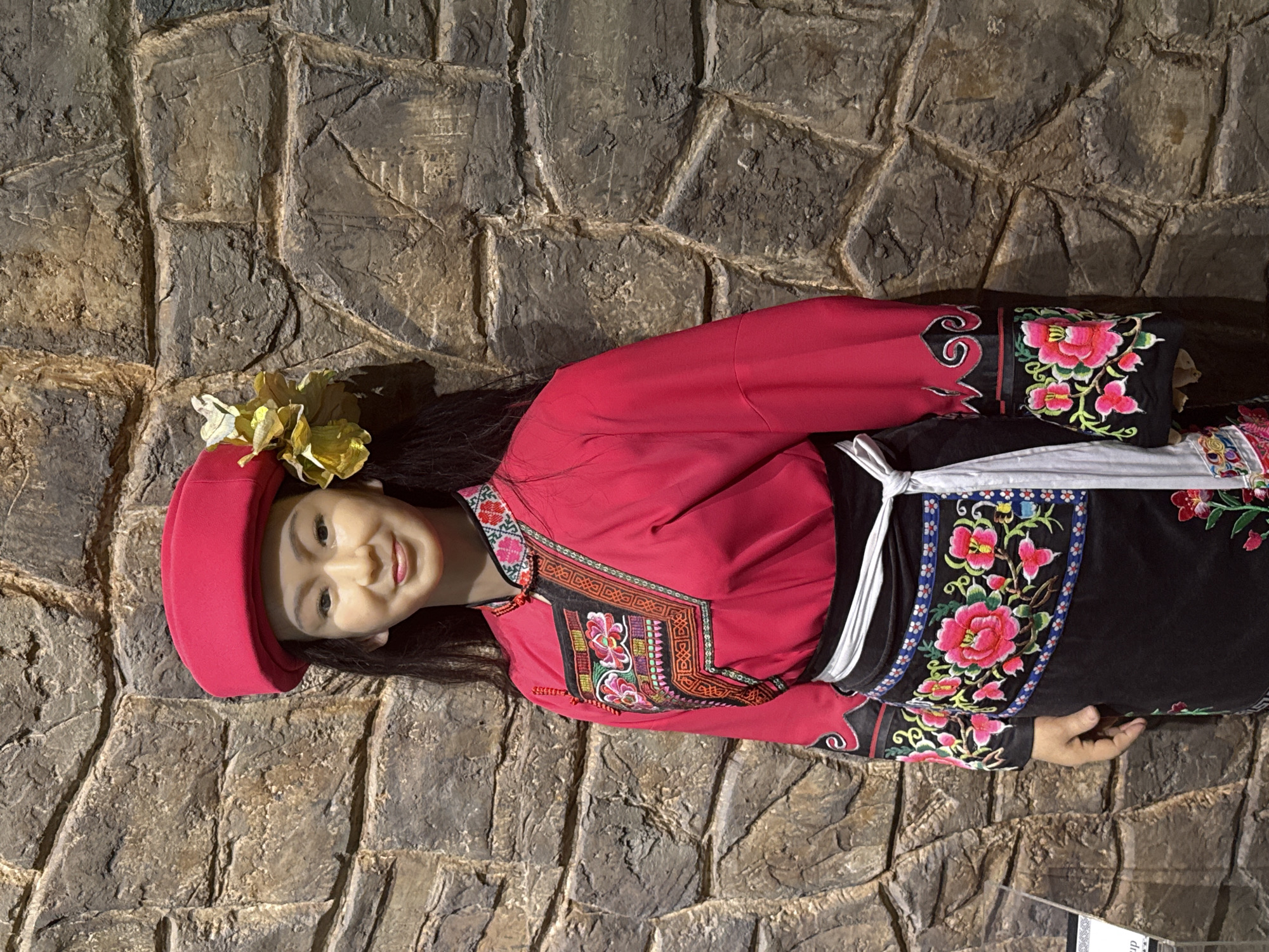 Museum visitor documents cultural exhibits in Yuzhong District