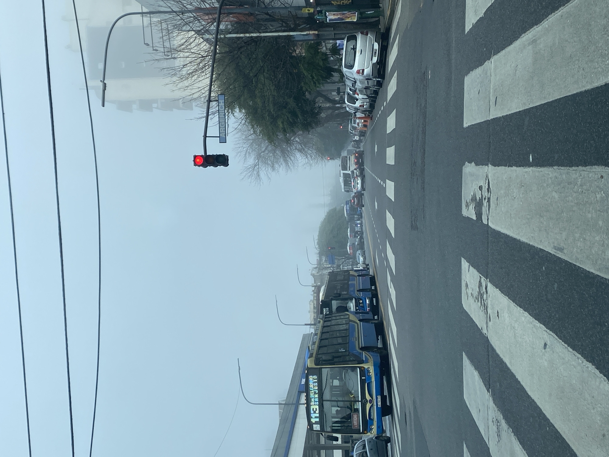 Buses halt on foggy Buenos Aires street