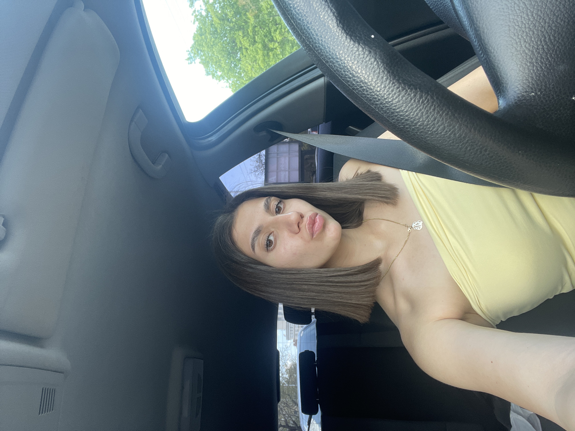 Woman takes playful car selfies in Sofia