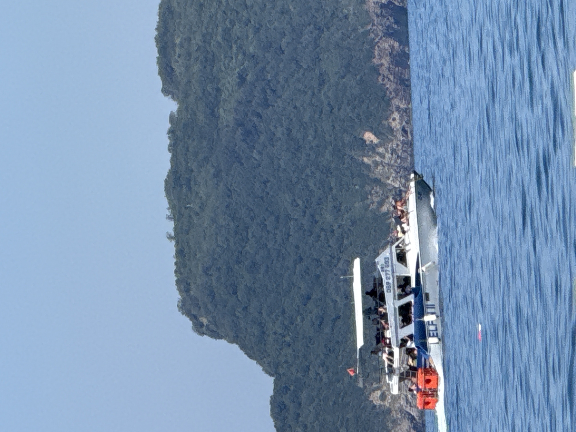 Summer morning on the Budva Riviera — boats, beaches, and changing skies