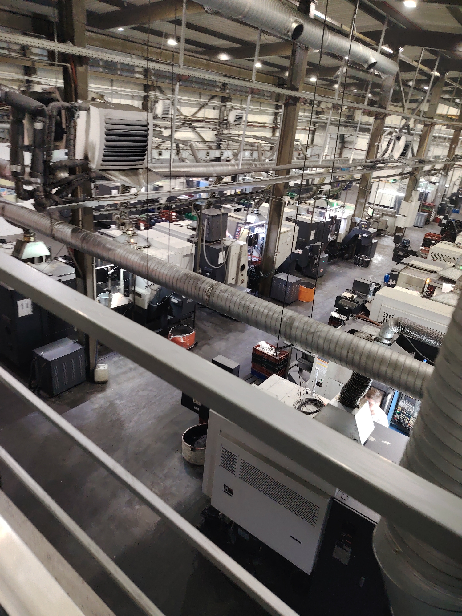 Worker in safety gear observed at industrial facility