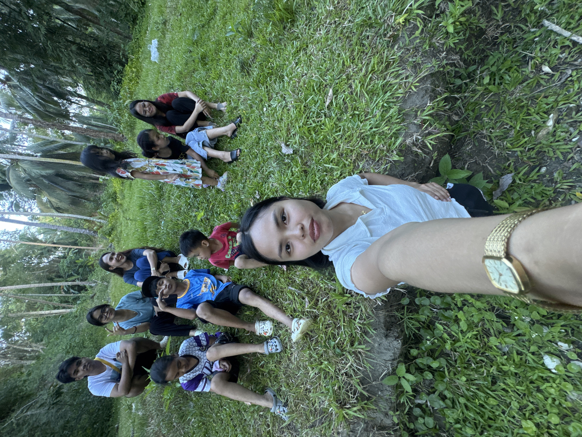 Family group gathers near tropical stream in Kiblawan