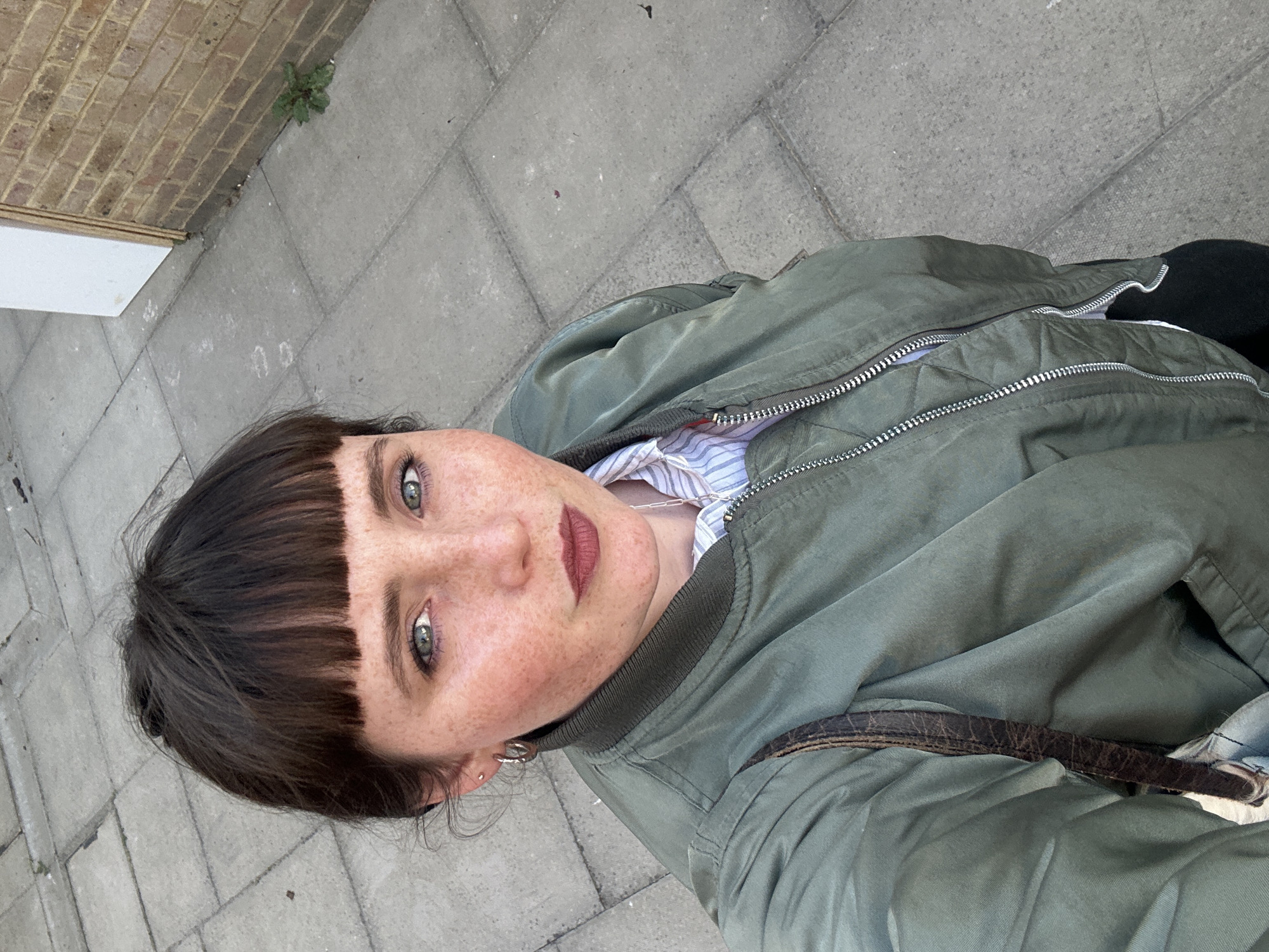 Woman takes selfie outdoors in London