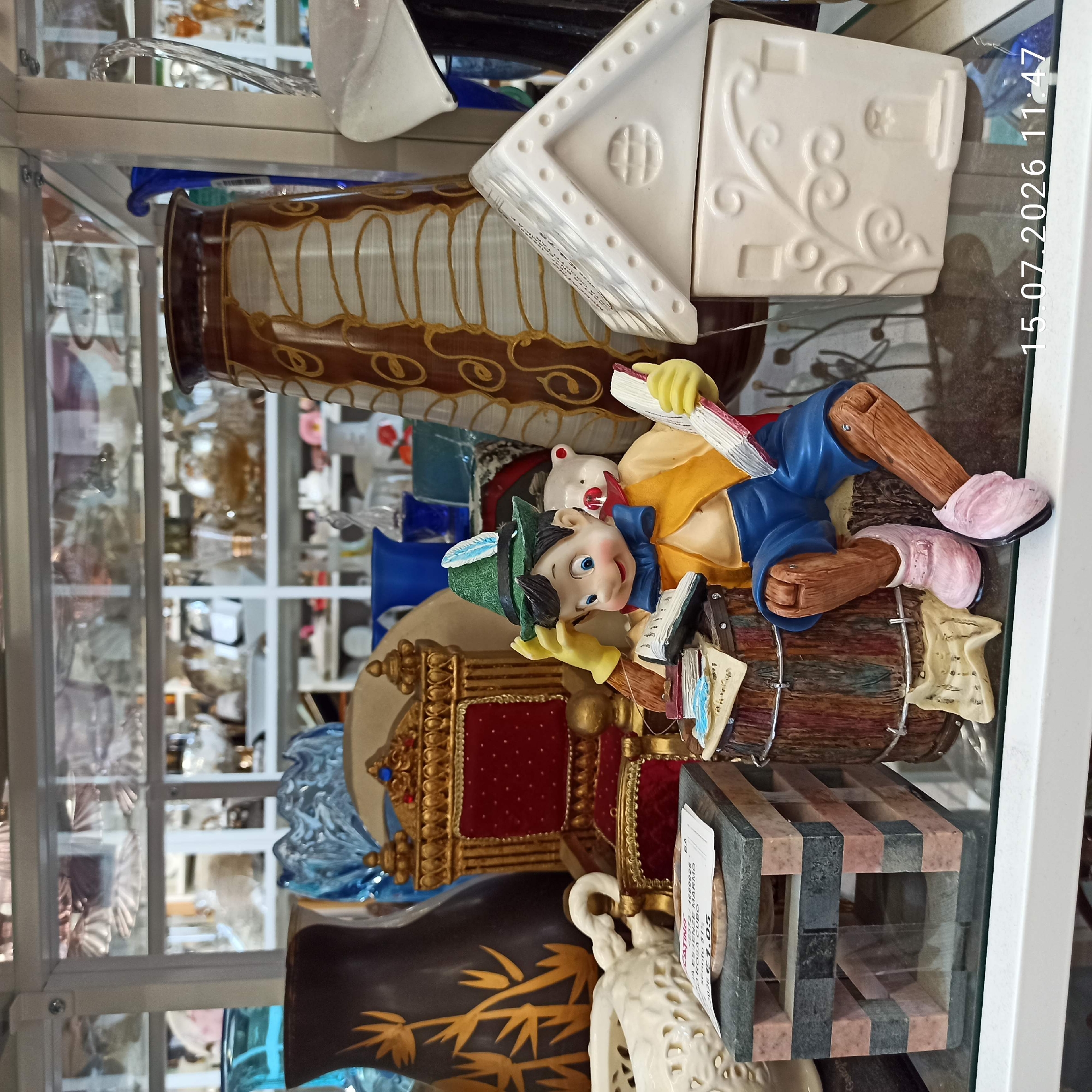 Inside a cluttered Molfetta antique shop full of ceramics and collectibles