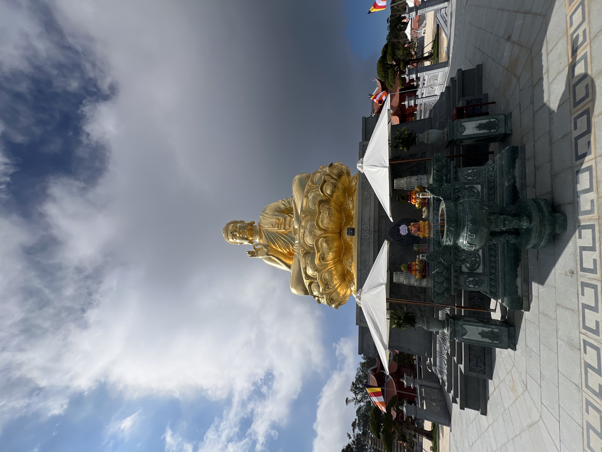 Golden Buddha statue documented at Vietnamese temple complex