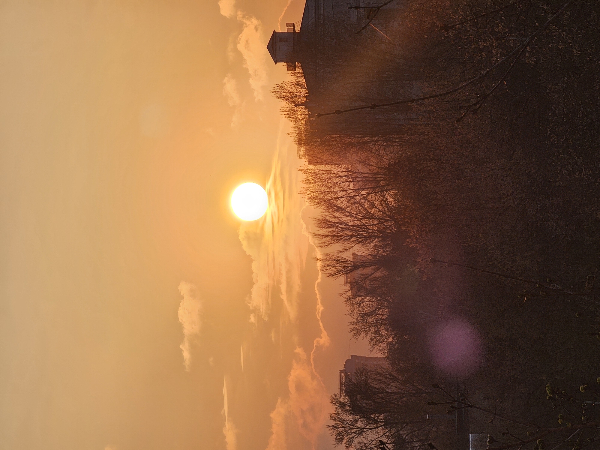 Witness captures vibrant sunset scene with brilliant white sun