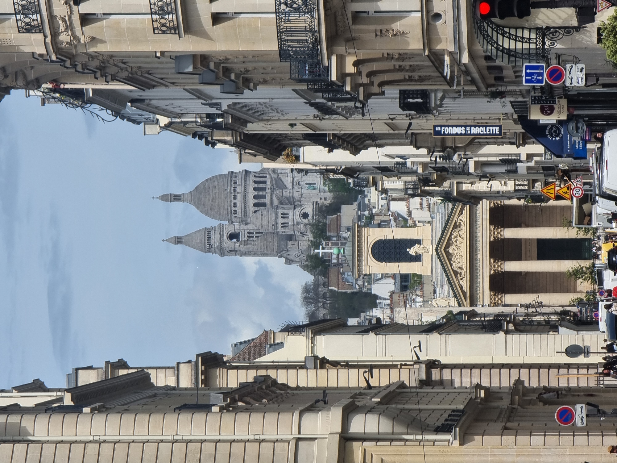Witness captures Paris street scene with Sacré-Cœur visible