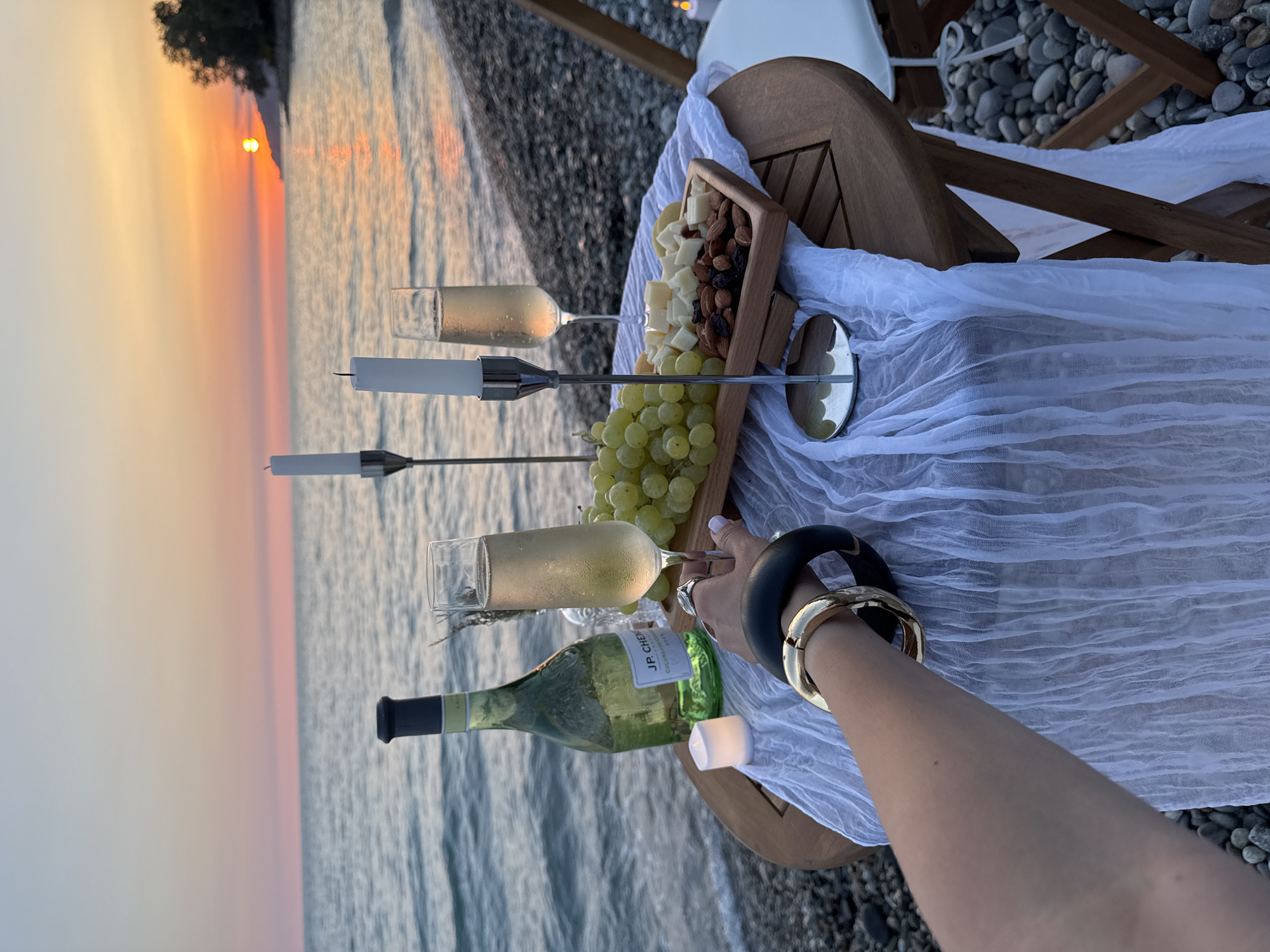 Sunset champagne picnic on Sochi's Black Sea pebble beach